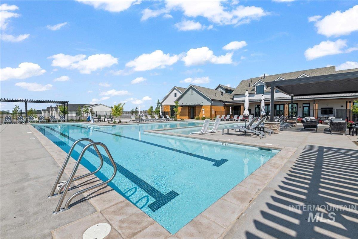 Community pool with a patio