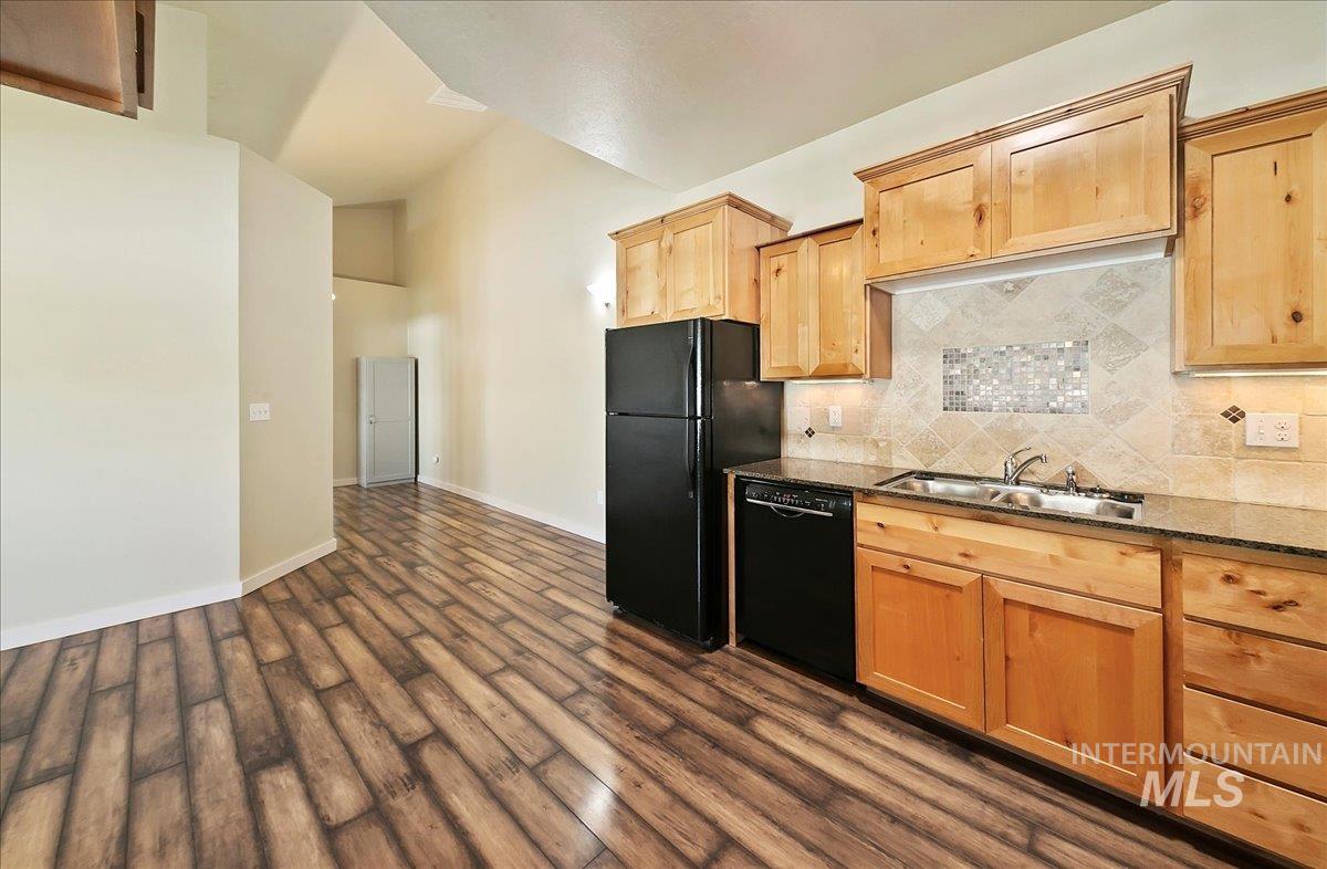 Kitchen flows to spacious area for a Table & Chairs & Hallway to Laundry and Bedrooms