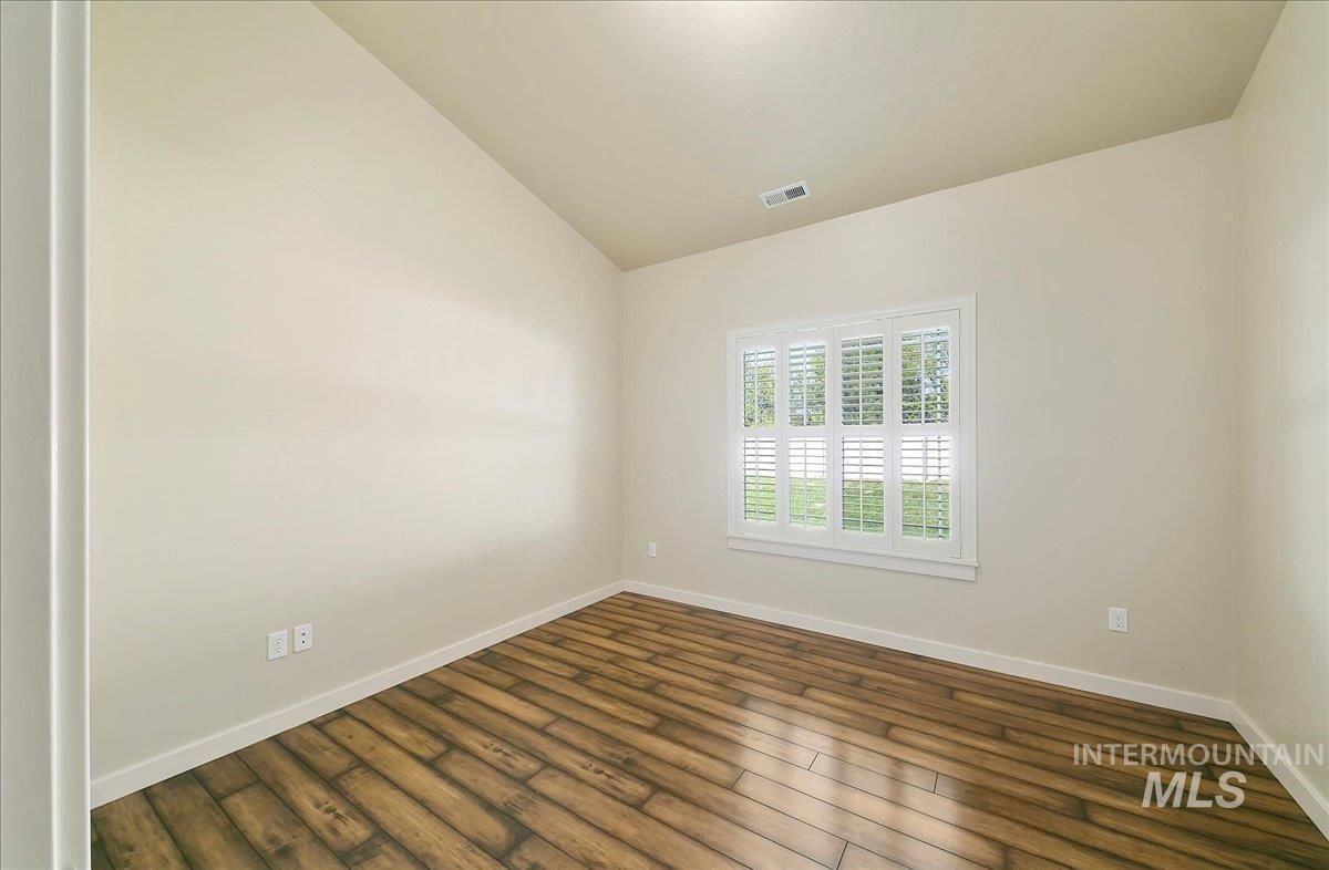 Second Bedroom is 11x11 & has a Spacious Closet, Plantation Style Blinds, Laminate Flooring!