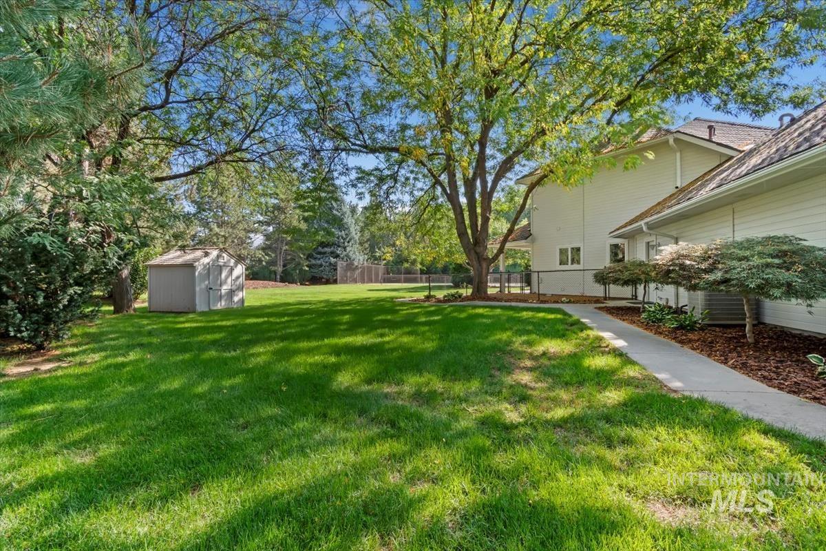 View of yard with a storage shed