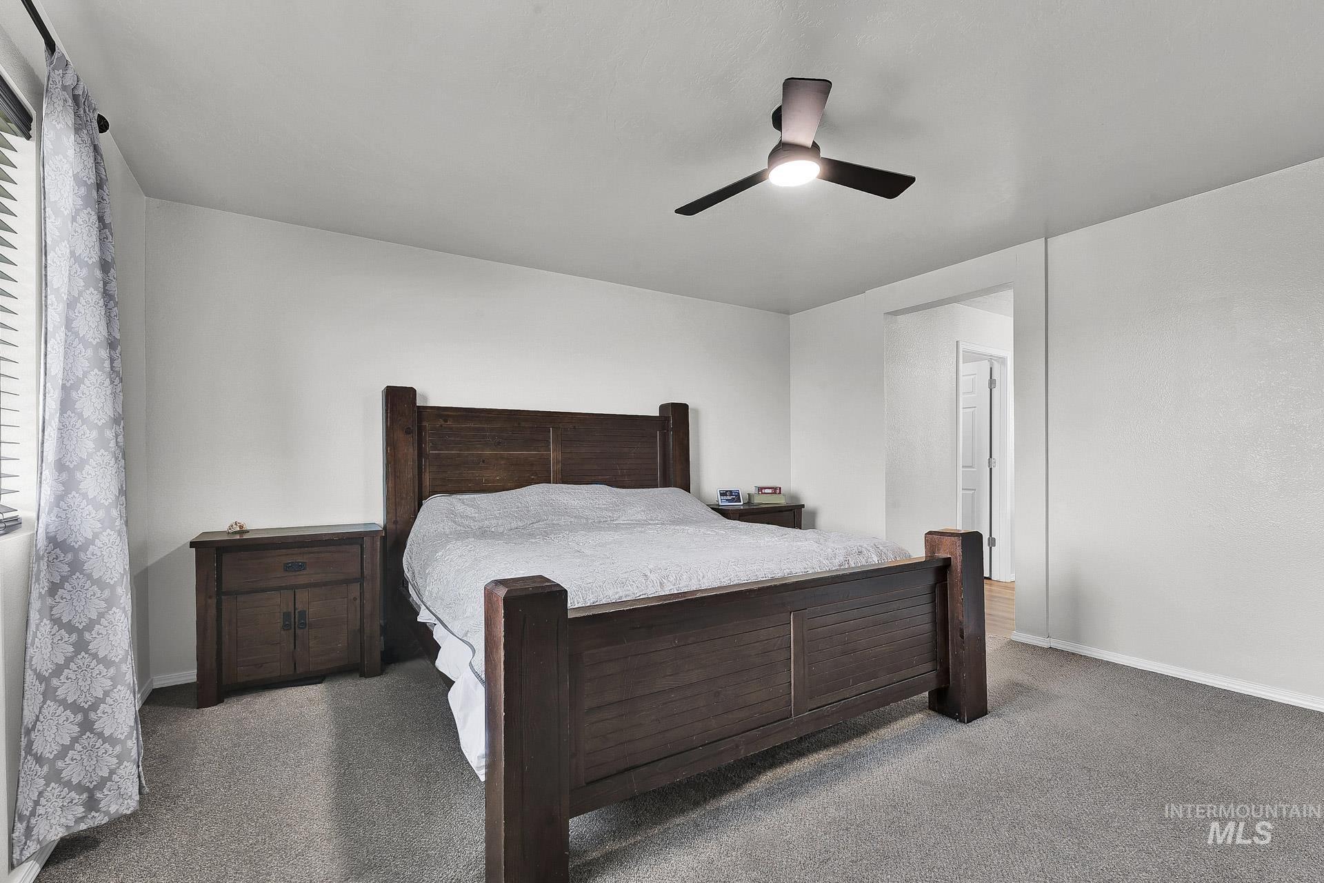 Bedroom featuring carpet floors and a ceiling fan