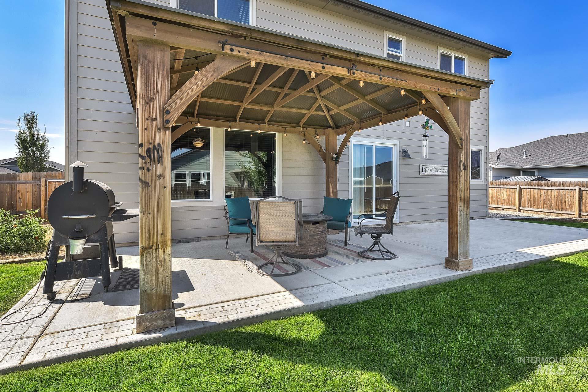 View of patio with a gazebo and area for grilling