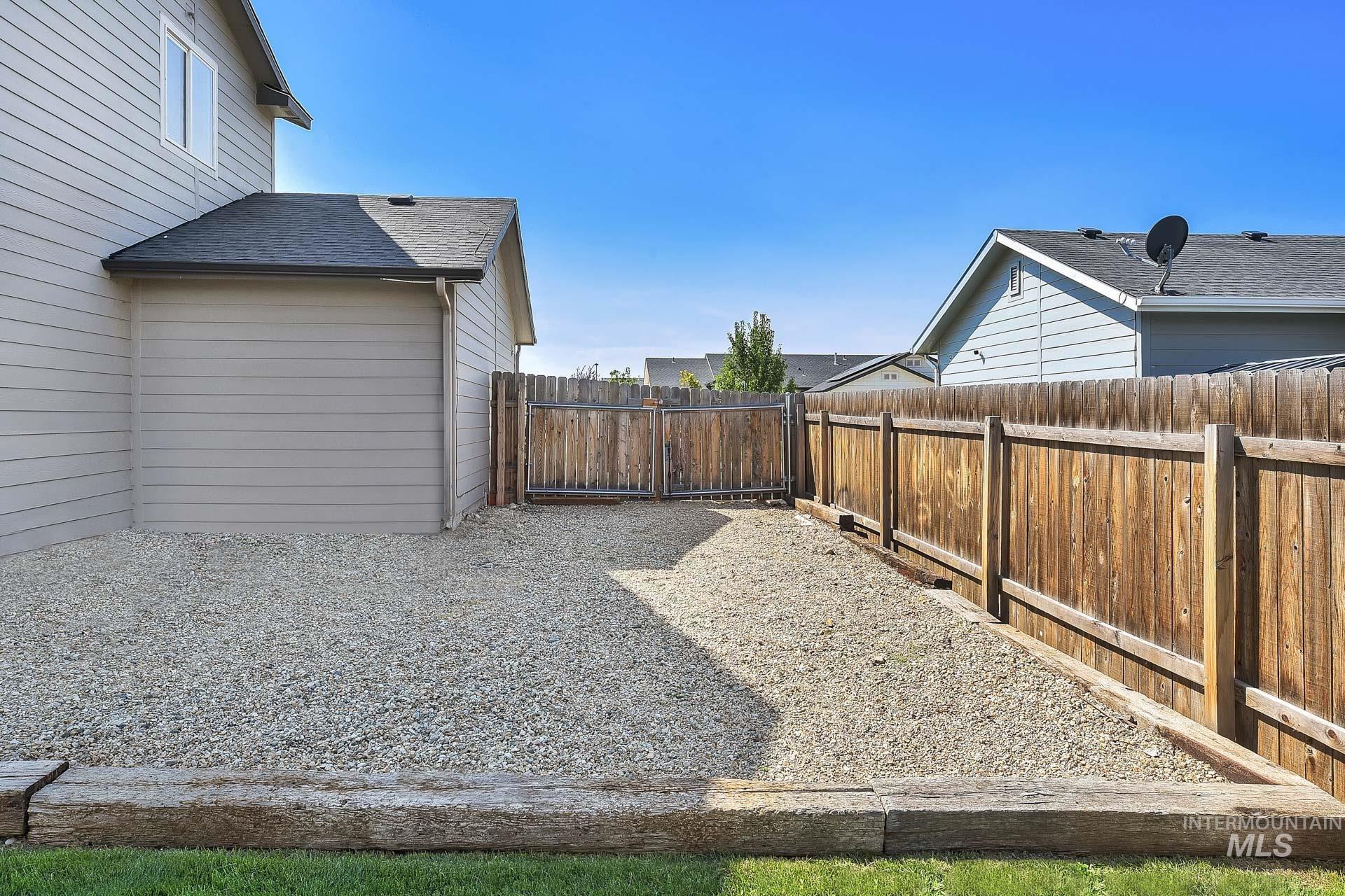 View of fenced backyard