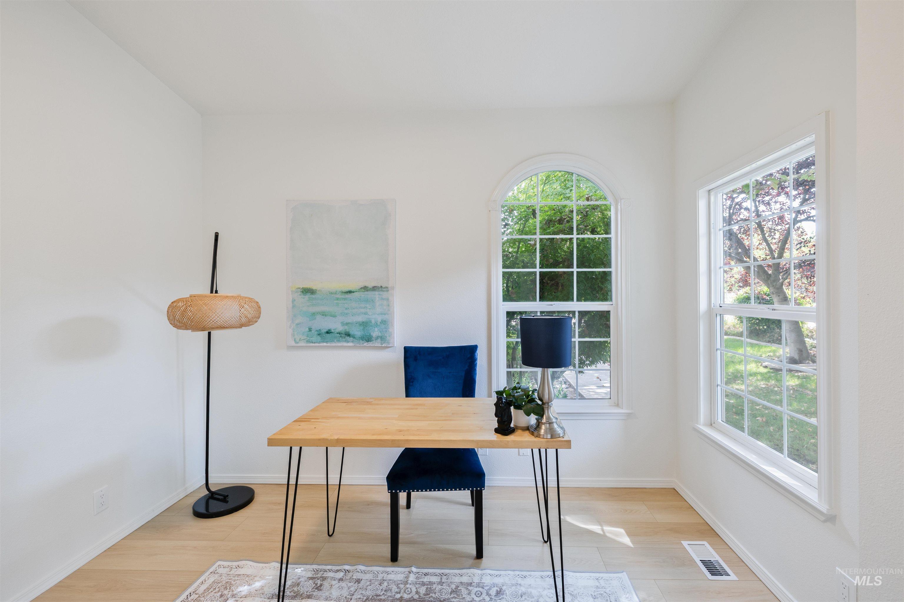 Office featuring light wood-style floors and baseboards