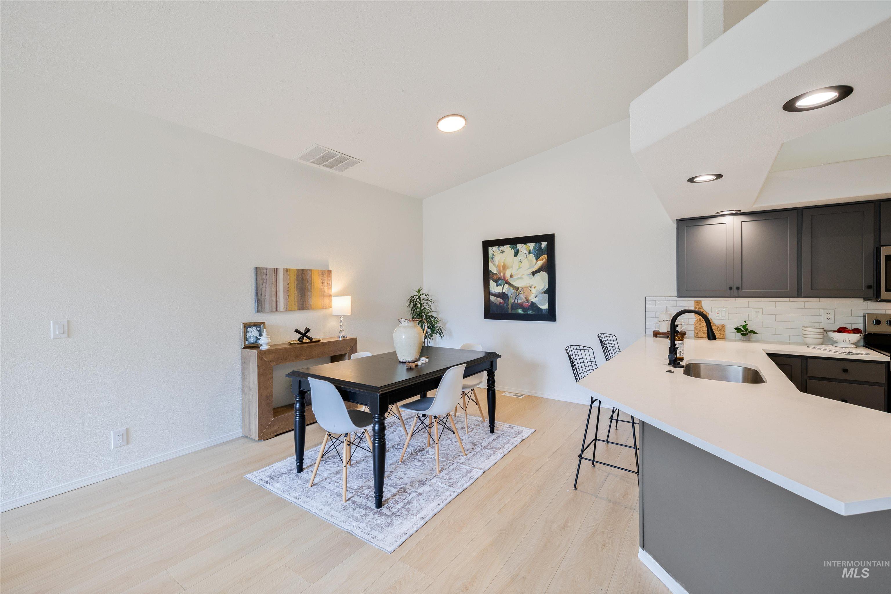 Dining area featuring recessed lighting and light wood-style floors