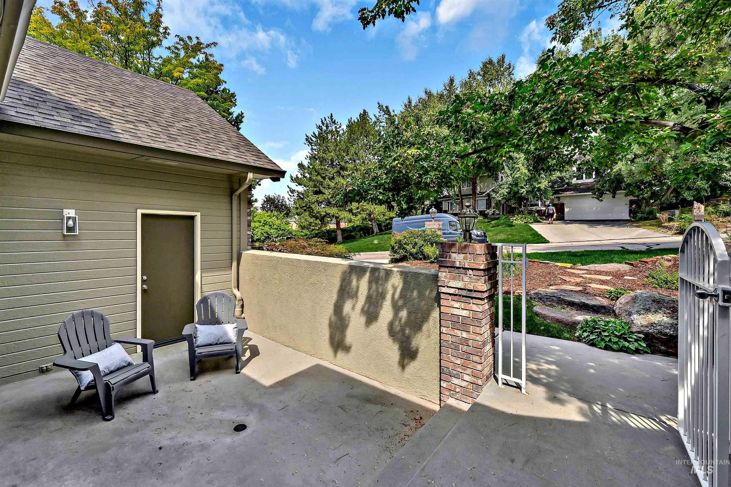 View of patio featuring a gate