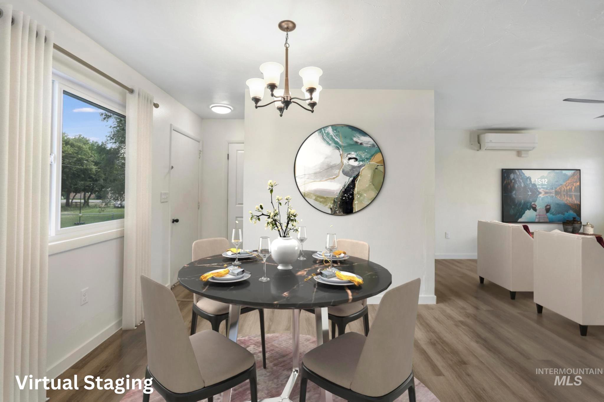 Dining space with wood finished floors, a chandelier, and an AC wall unit