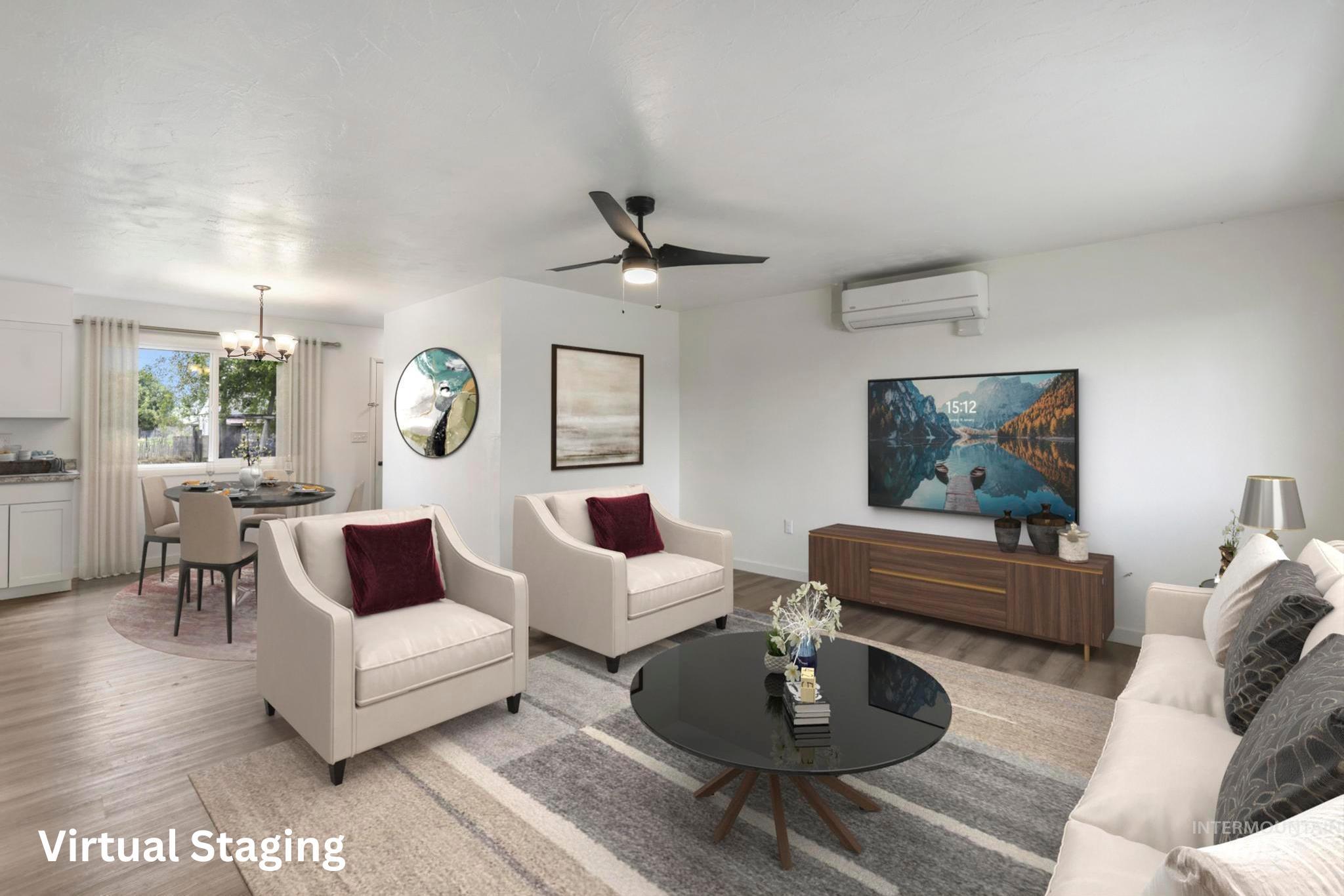 Living room with wood finished floors, a ceiling fan, a chandelier, and a wall mounted AC