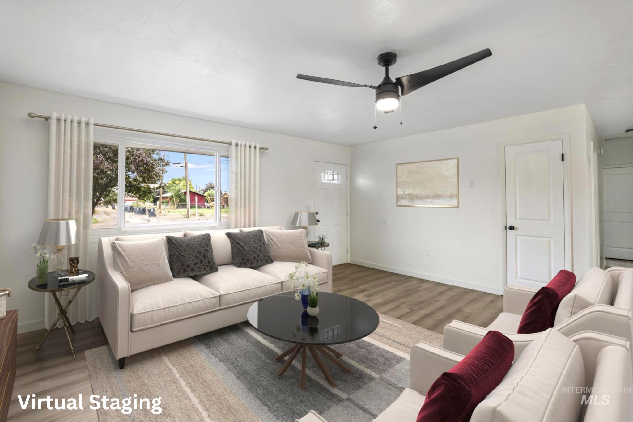 Living area featuring wood finished floors and ceiling fan