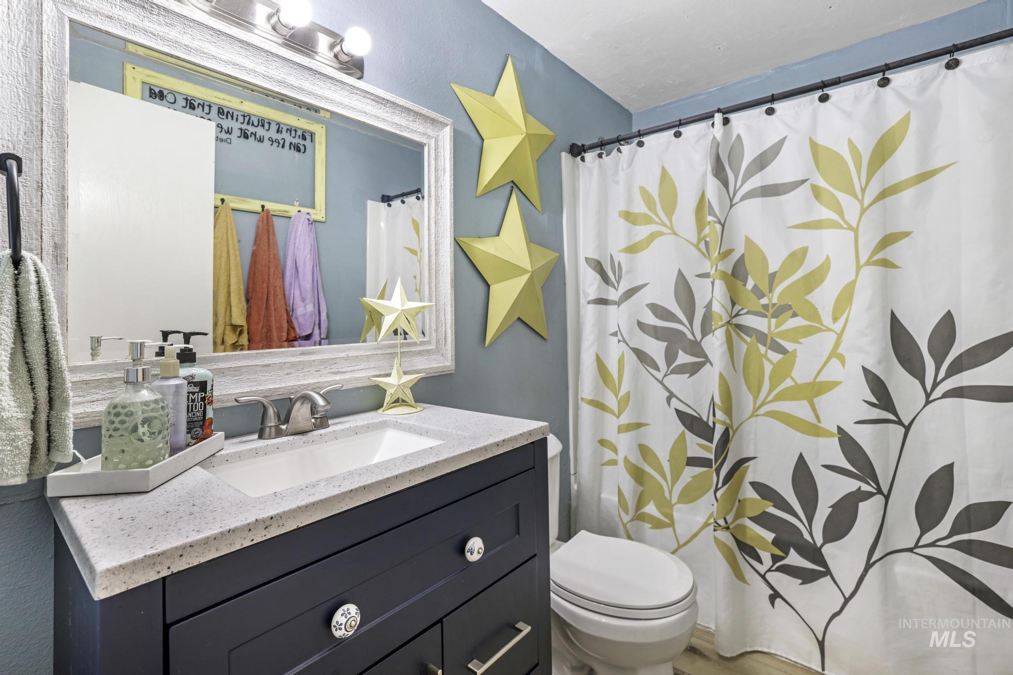 Bathroom with vanity and a shower with curtain