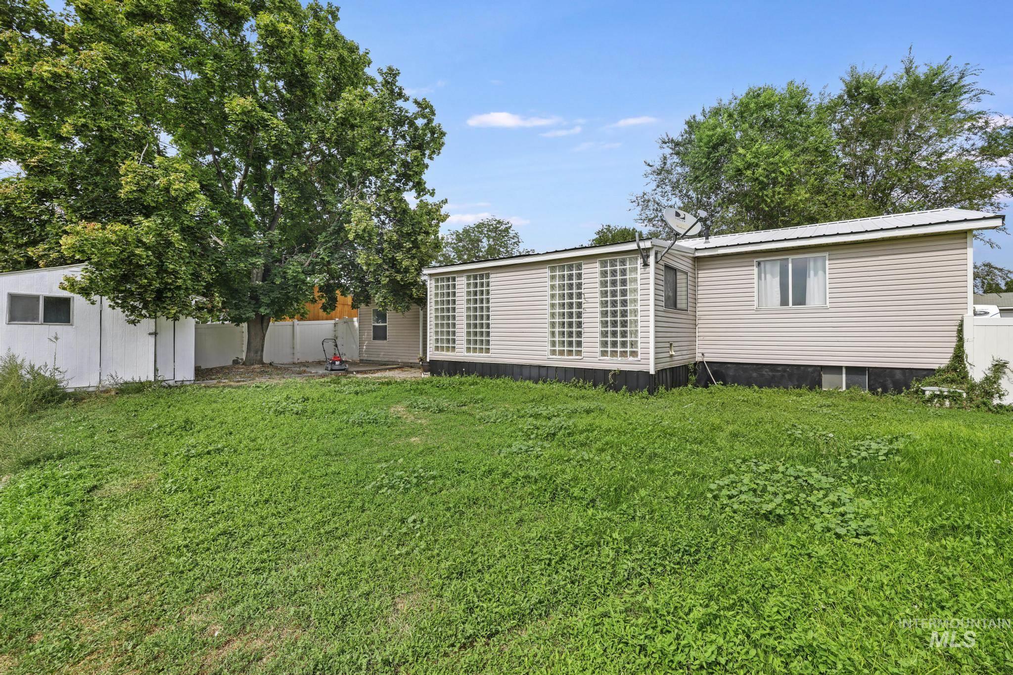 Back of property with a metal roof