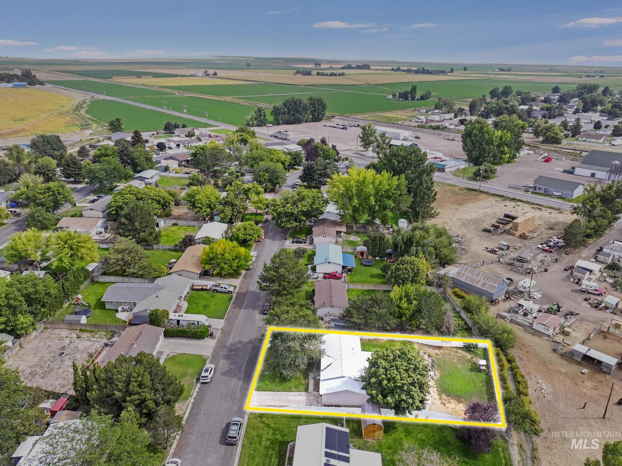 Aerial view of residential area with property boundaries highlighted