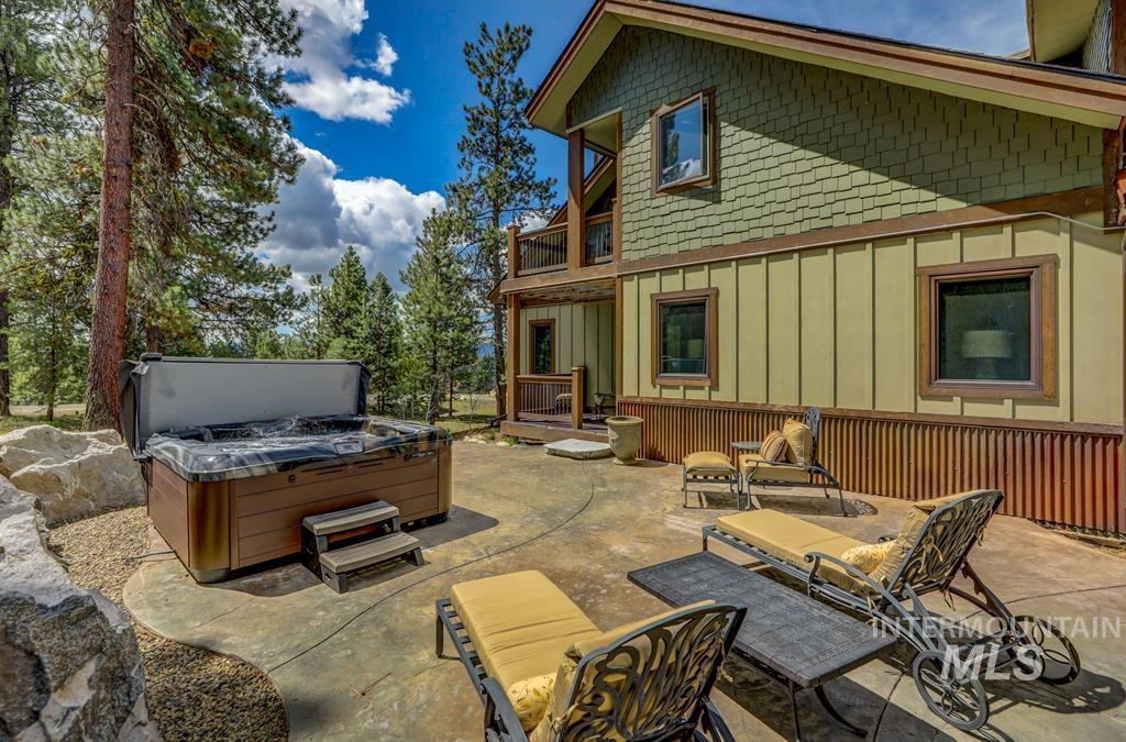Patio / terrace featuring a patio and a hot tub