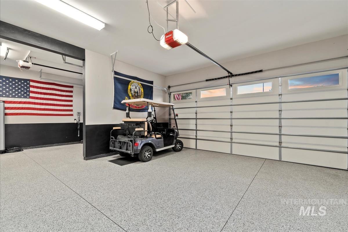 Garage featuring a garage door opener