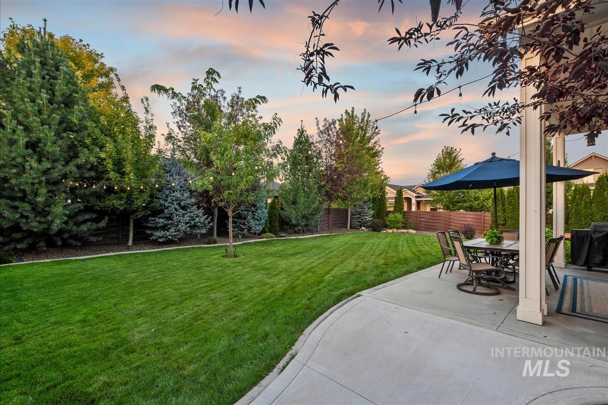 View of yard featuring a patio area and outdoor dining space