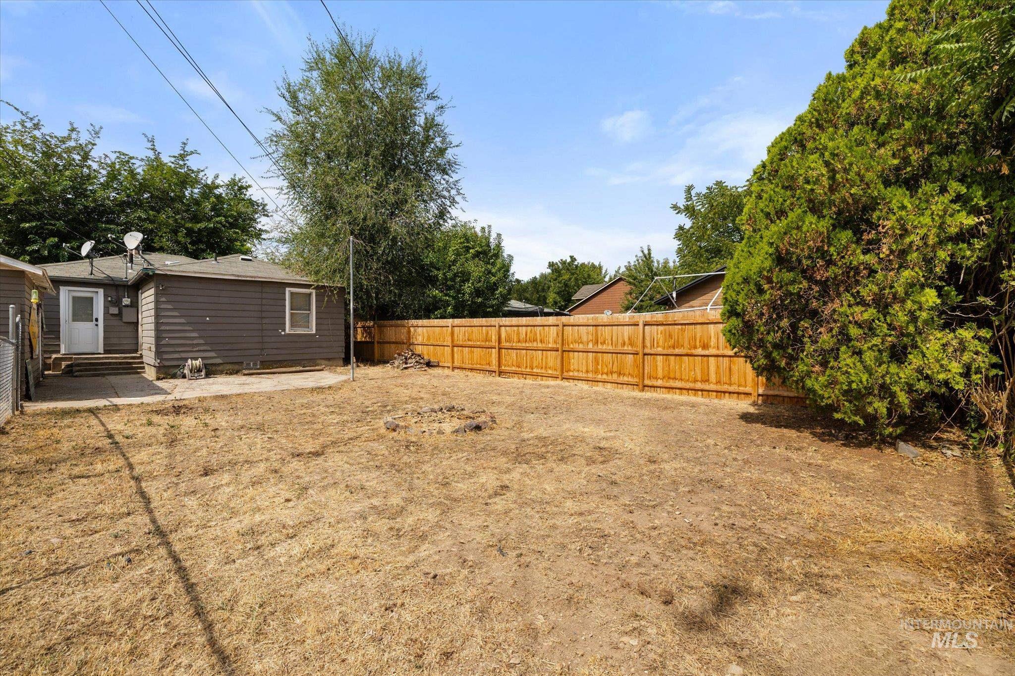 Fenced backyard featuring a patio area