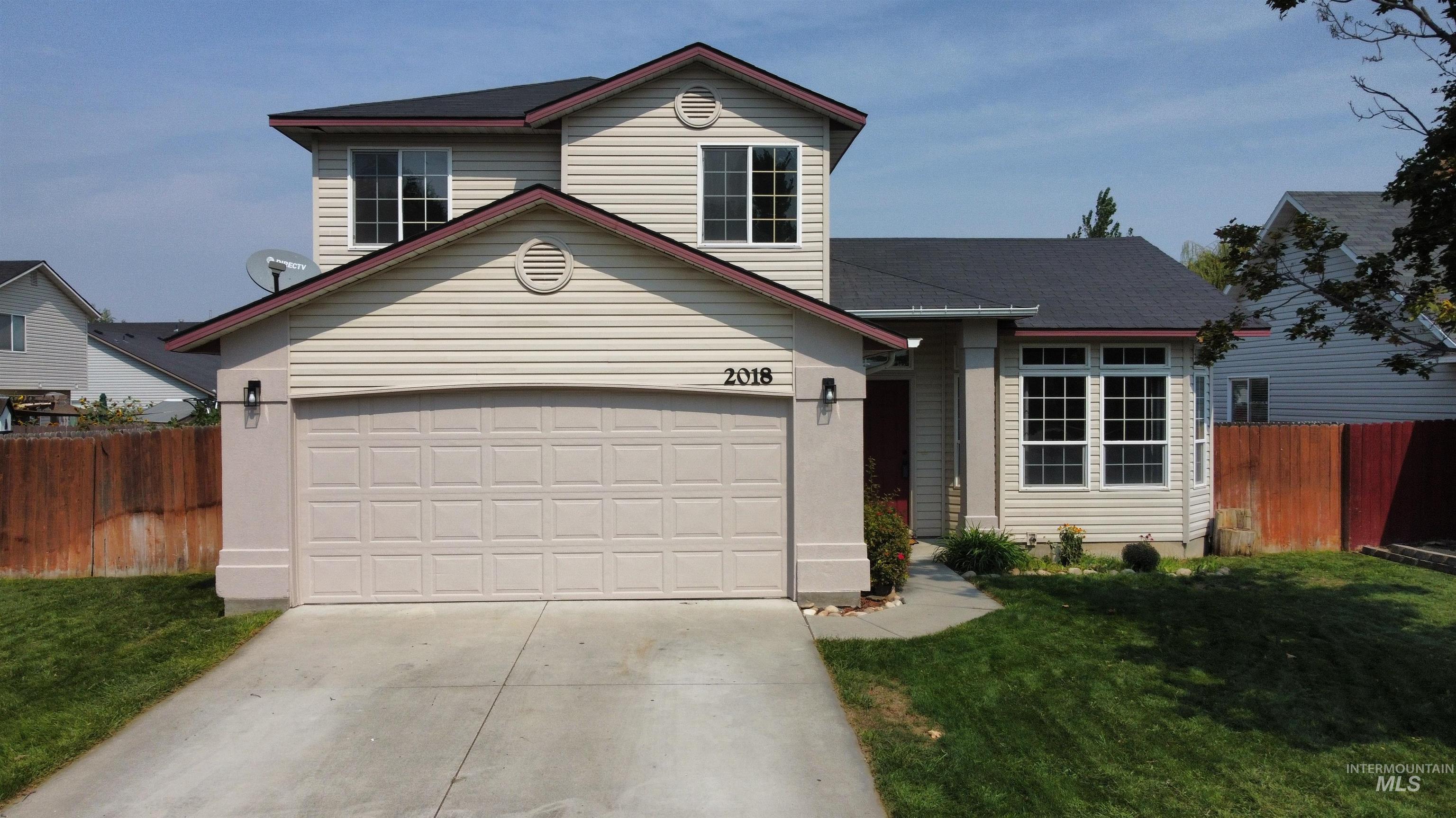 Traditional home with concrete driveway