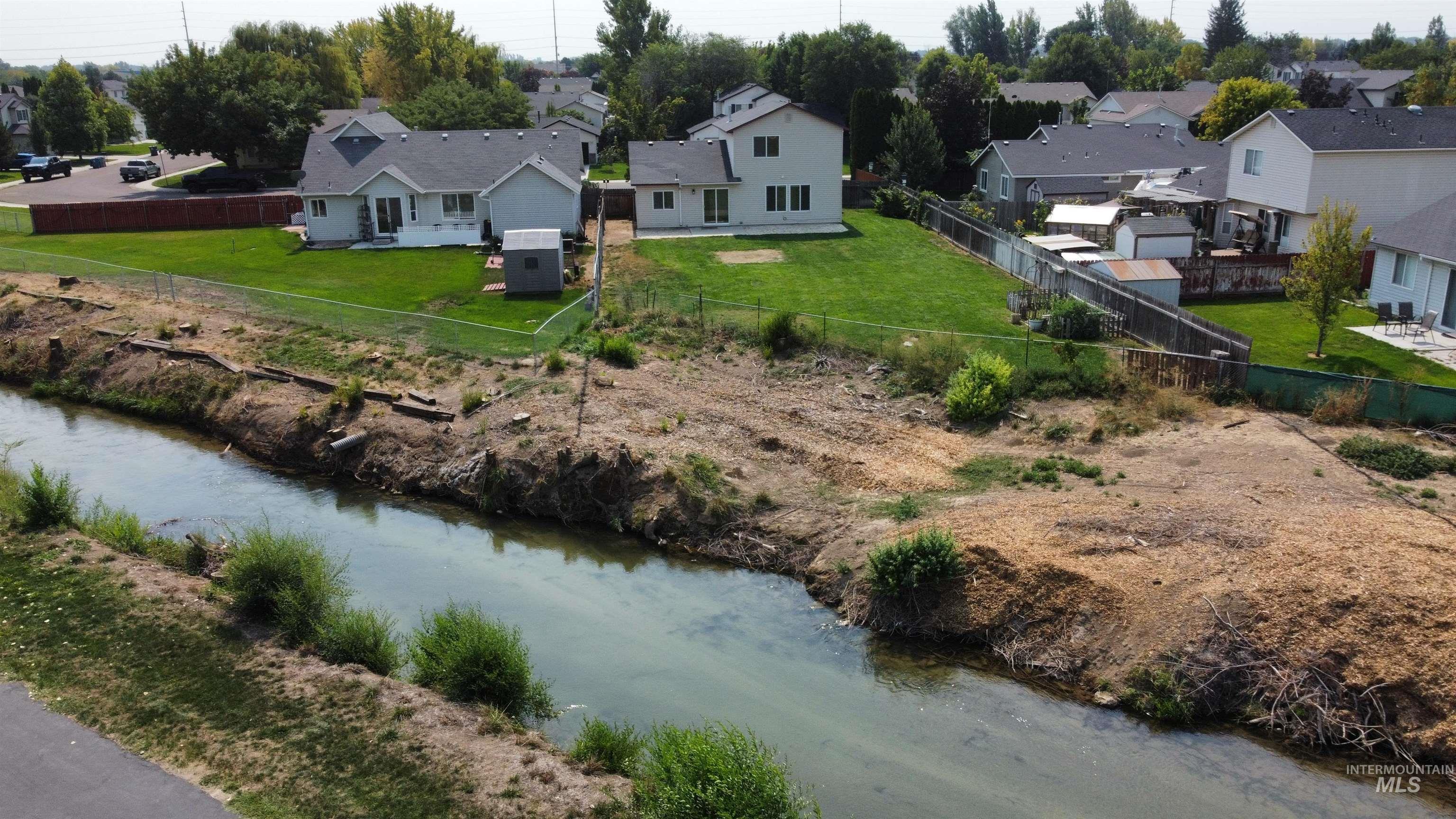 Aerial view of residential area with a nearby body of water