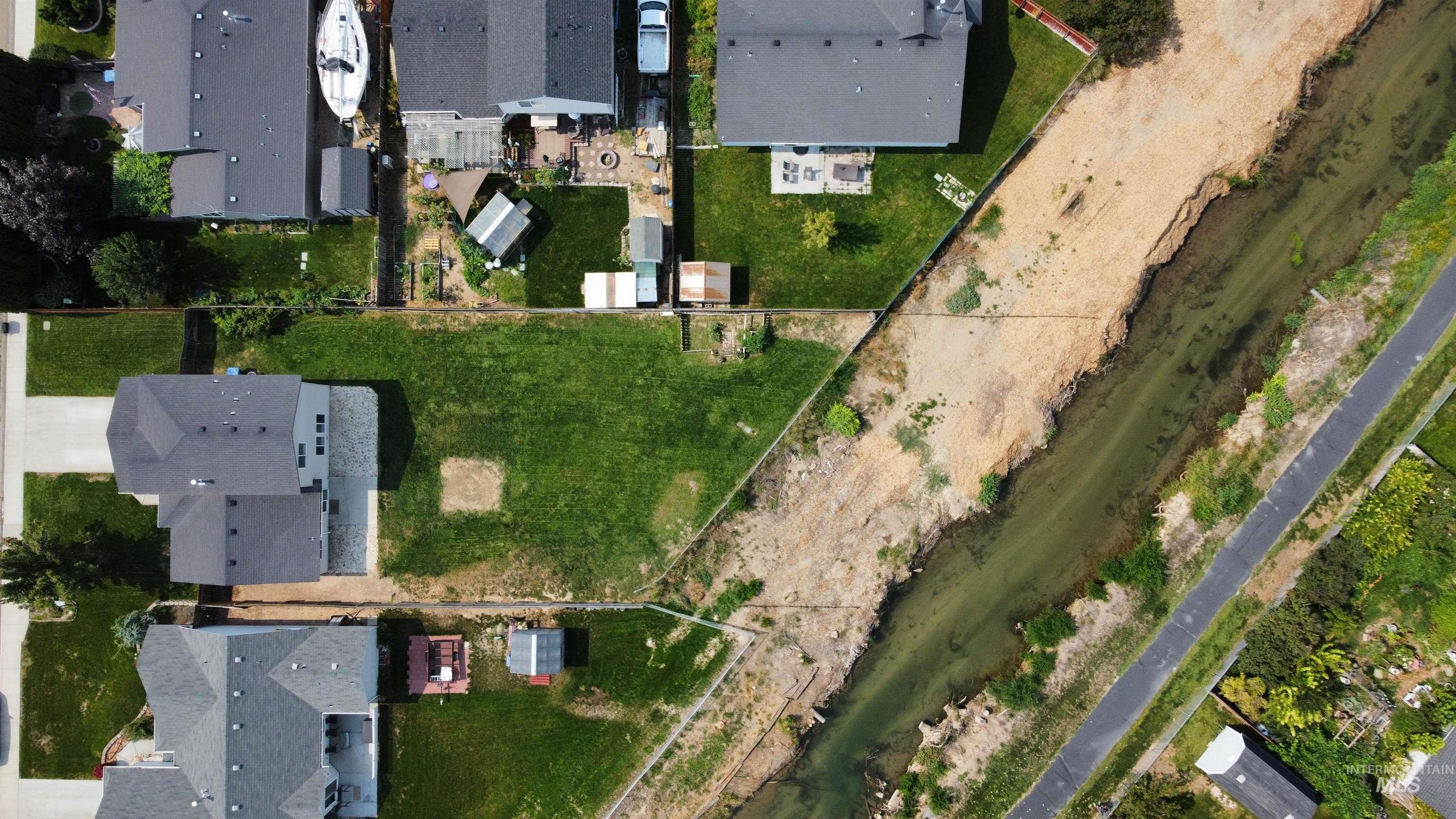 View of property location with nearby suburban area