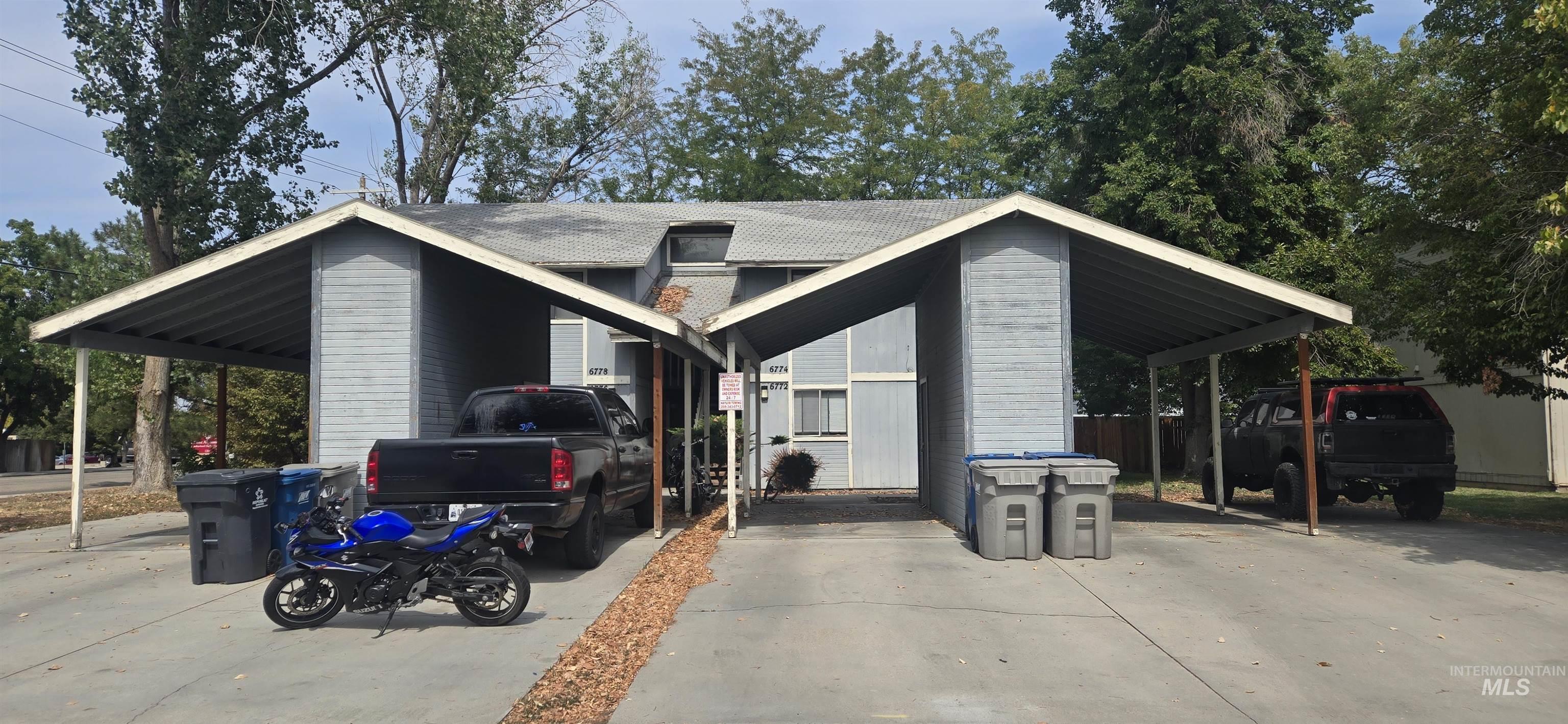View of car parking featuring a carport