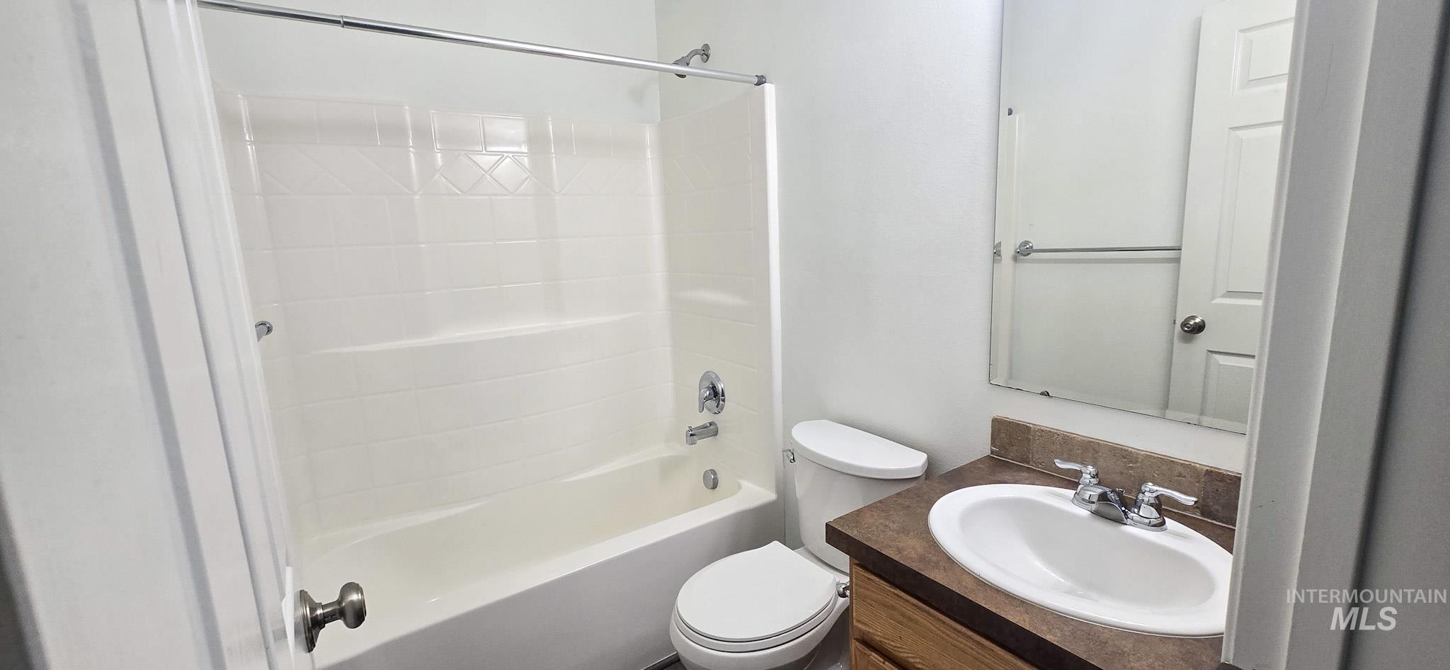 Bathroom featuring vanity and shower / bath combination