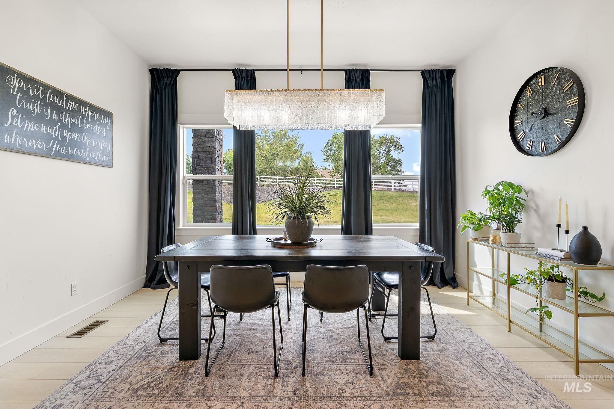 Dining area with healthy amount of natural light and light wood-type flooring