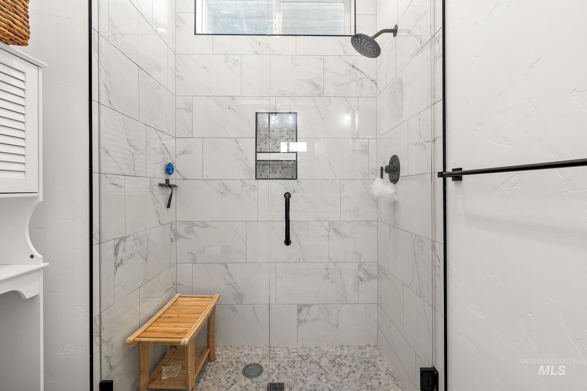Full bathroom with a stall shower
