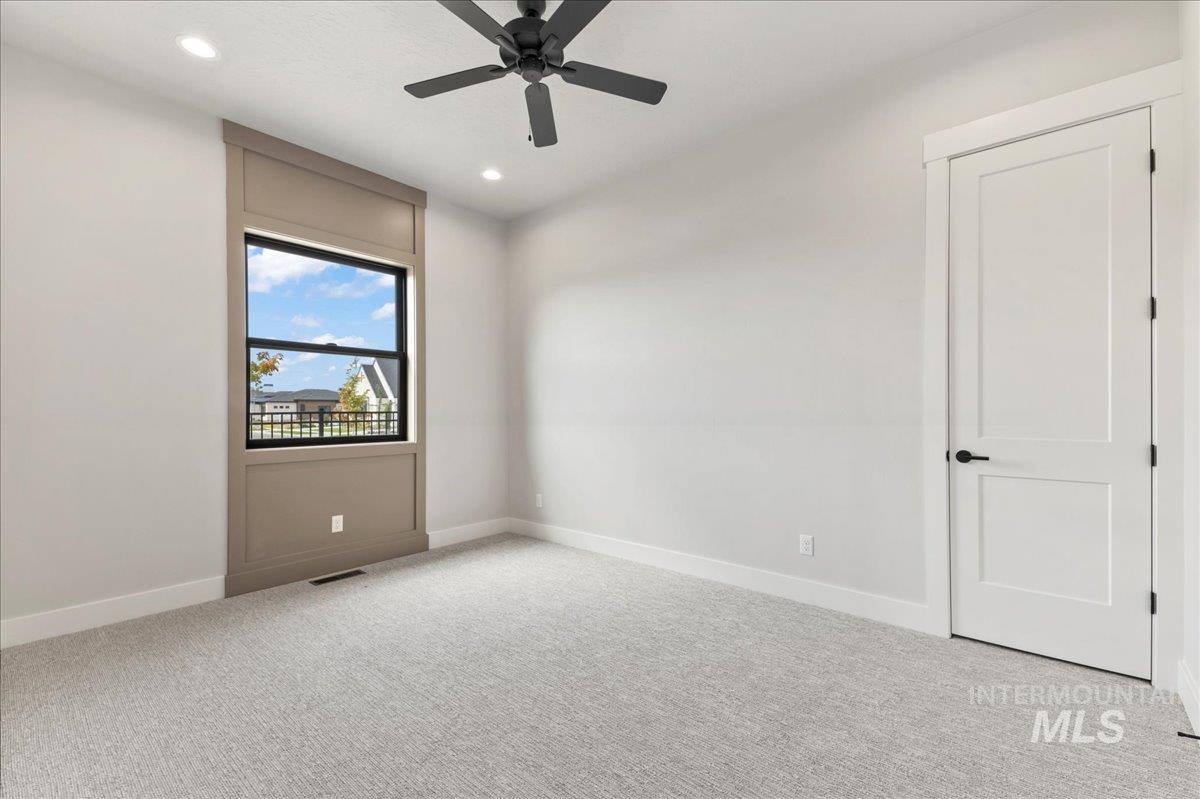 Unfurnished room with light carpet, recessed lighting, and a ceiling fan