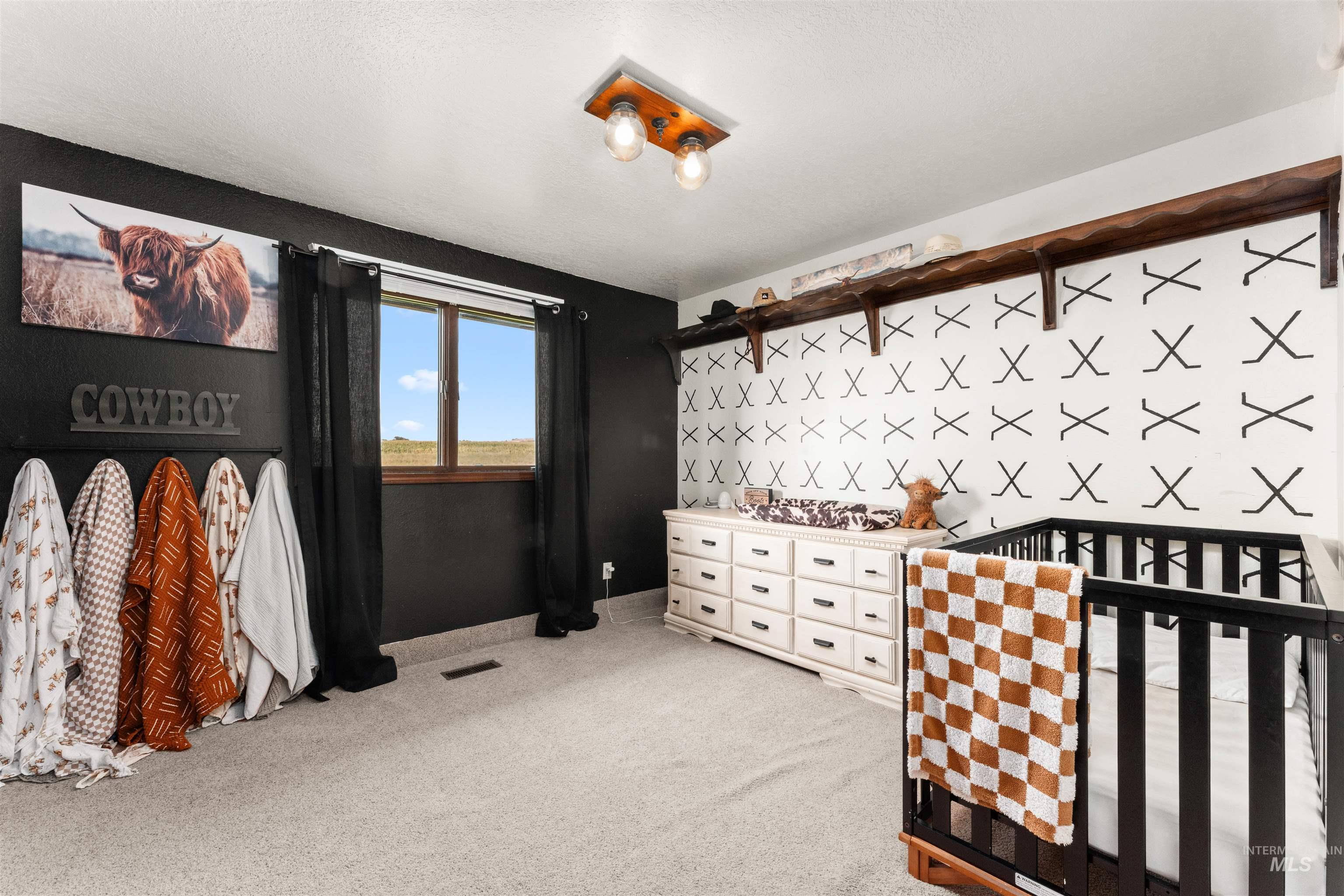 Bedroom with light carpet and baseboards