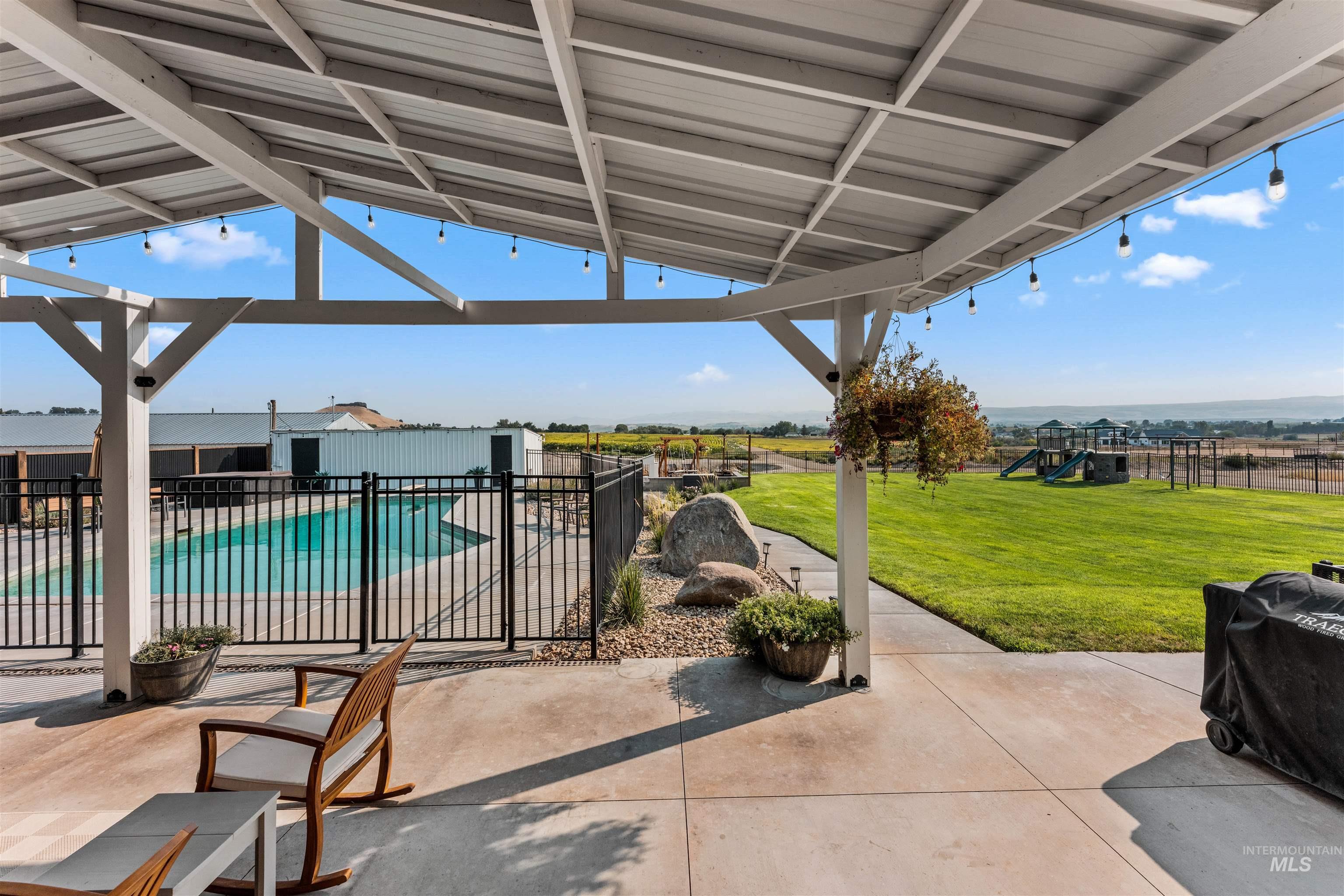 View of patio / terrace featuring a playground and area for grilling
