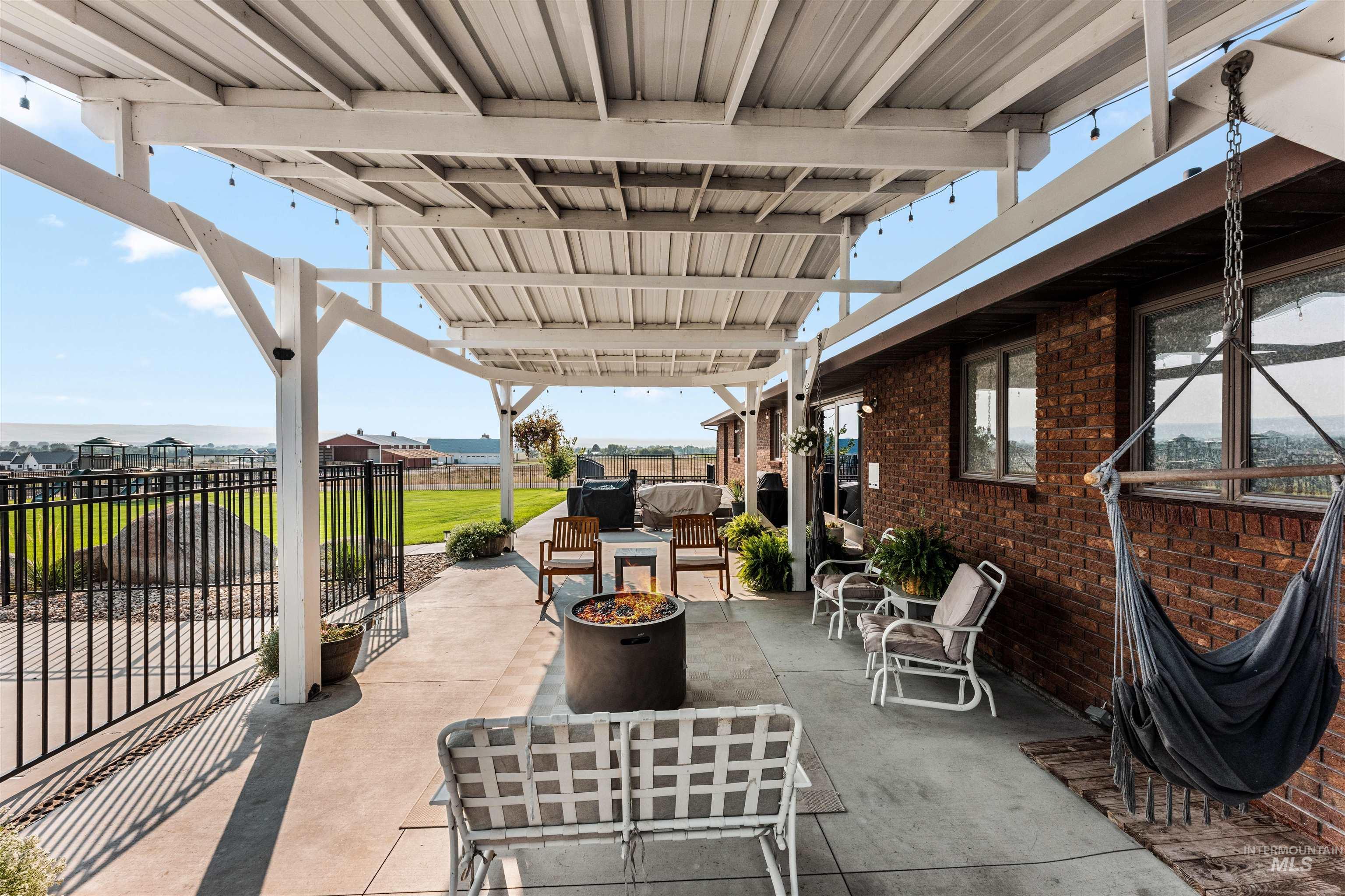 View of patio featuring a fire pit