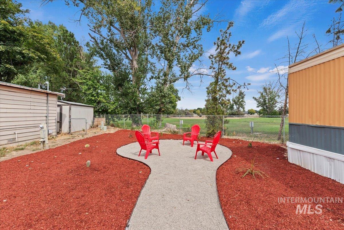 Fenced backyard with a patio