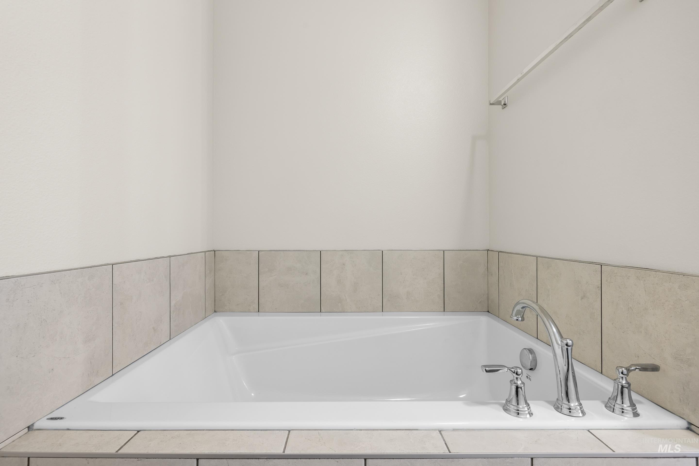 Full bath featuring a bath