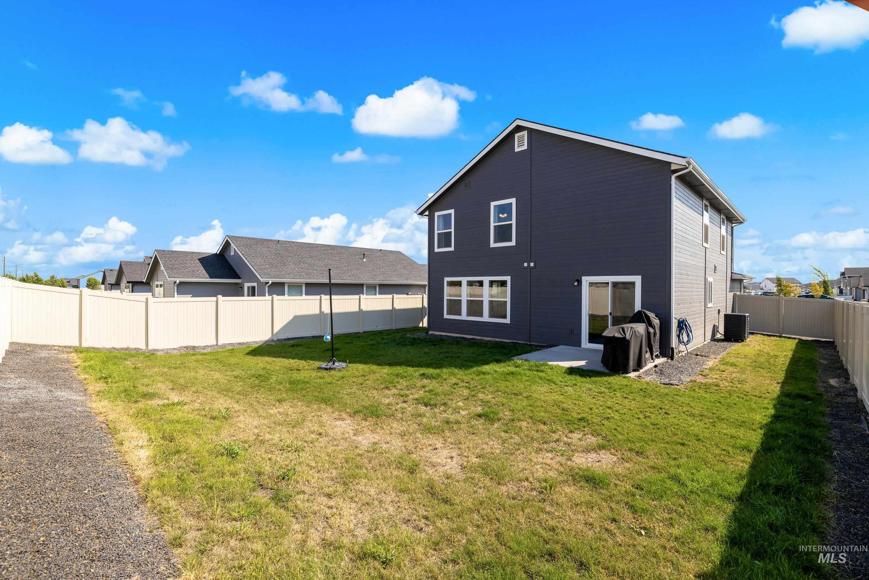 Back of house featuring a fenced backyard and a patio area