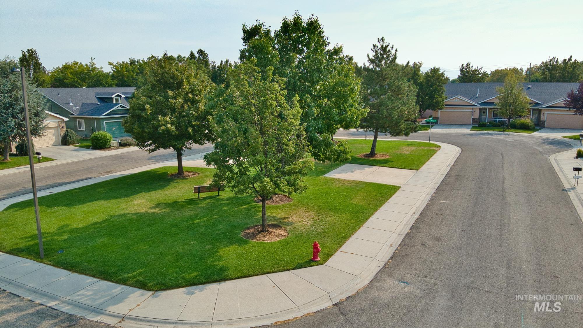 View of home's community featuring a yard
