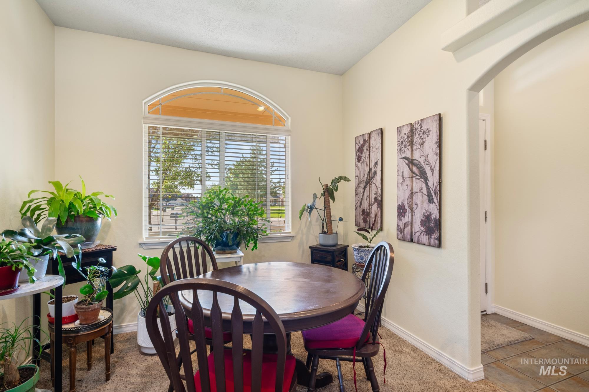 Dining area featuring baseboards and light tile patterned floors