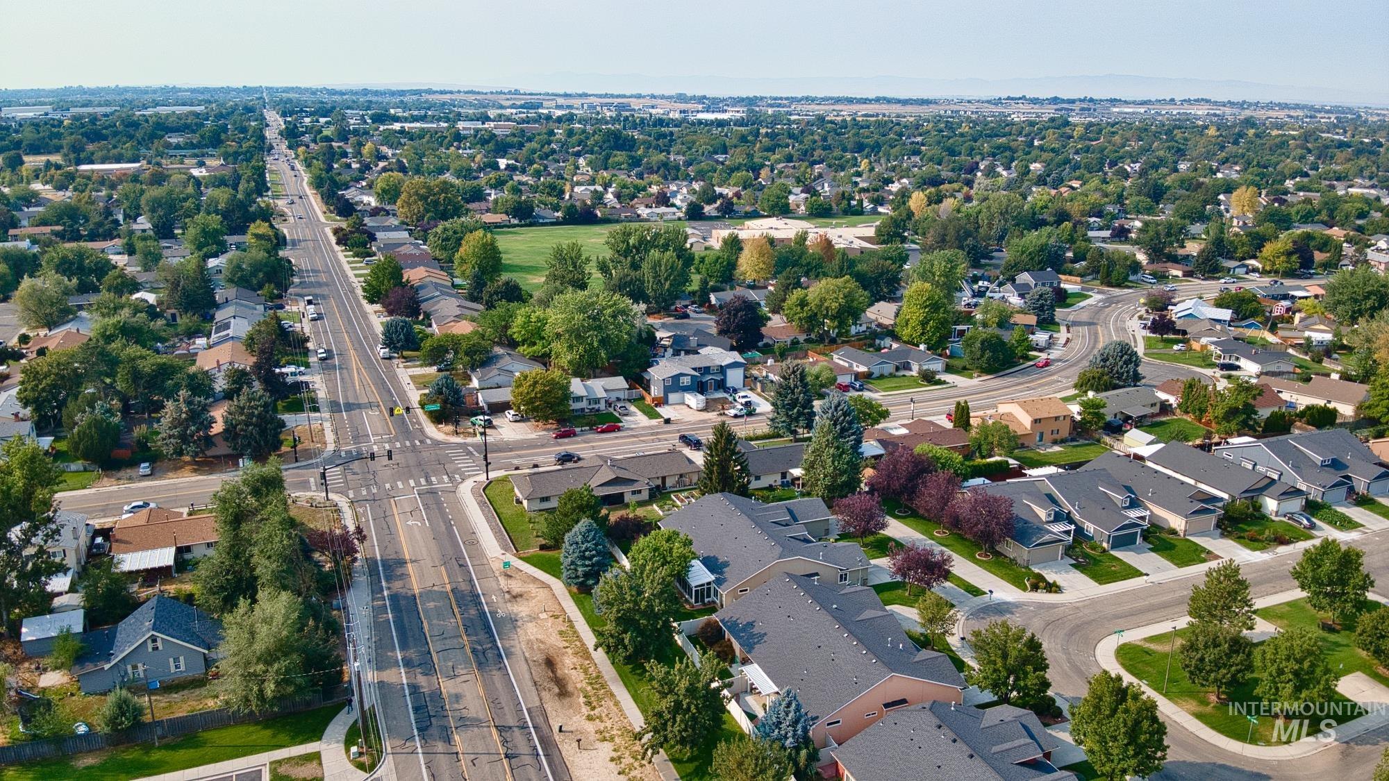 View of property location with nearby suburban area