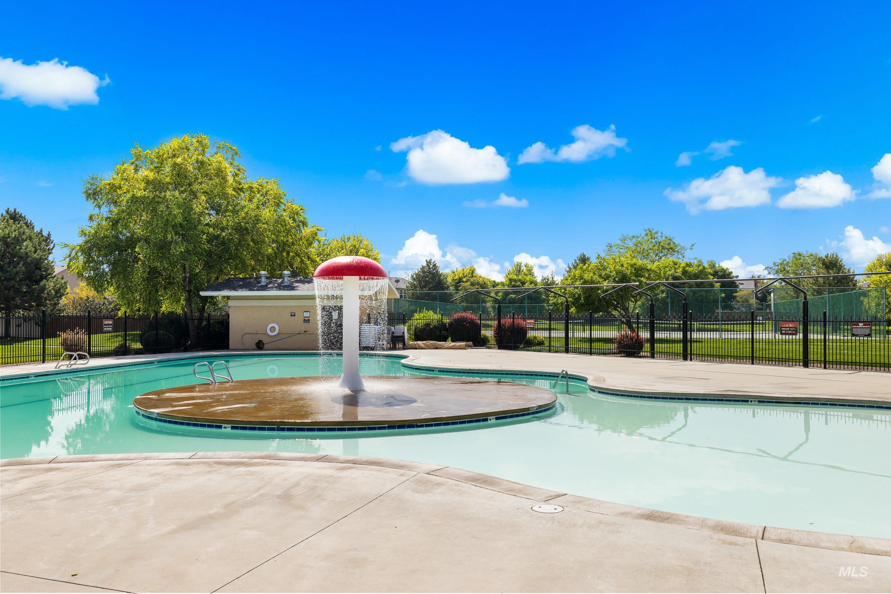 Community pool featuring a patio area