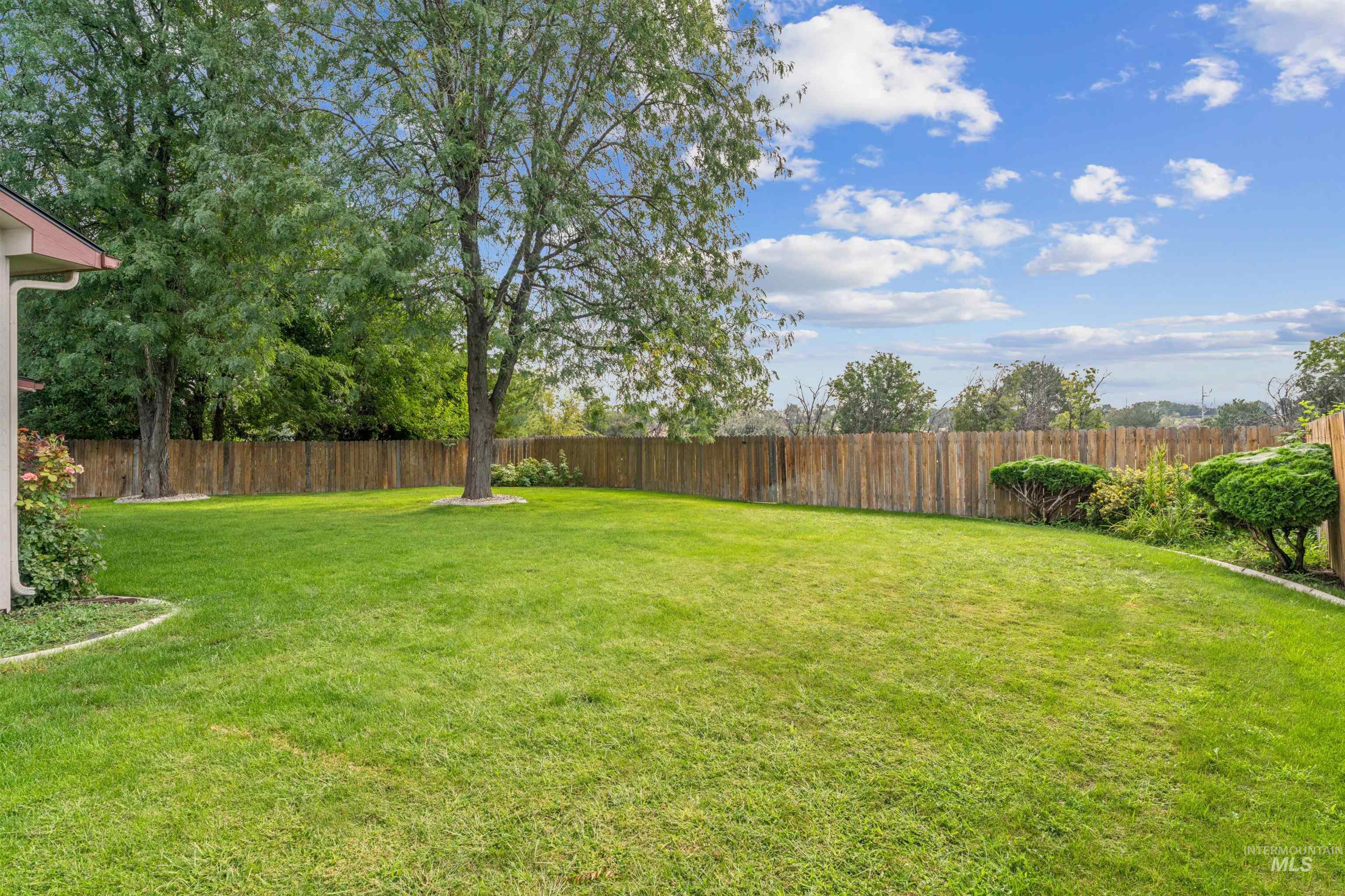 View of fenced backyard