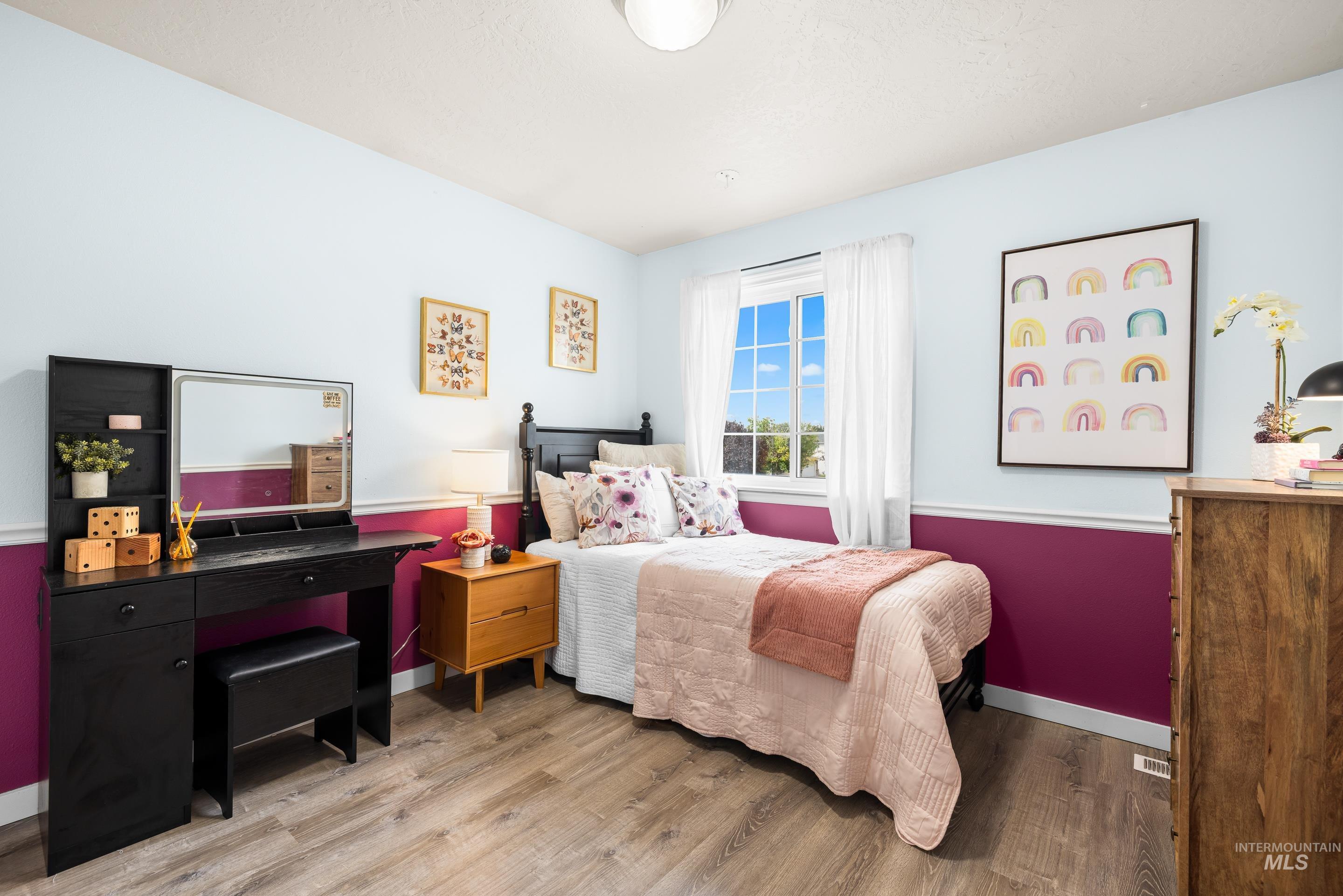 Bedroom with wood finished floors