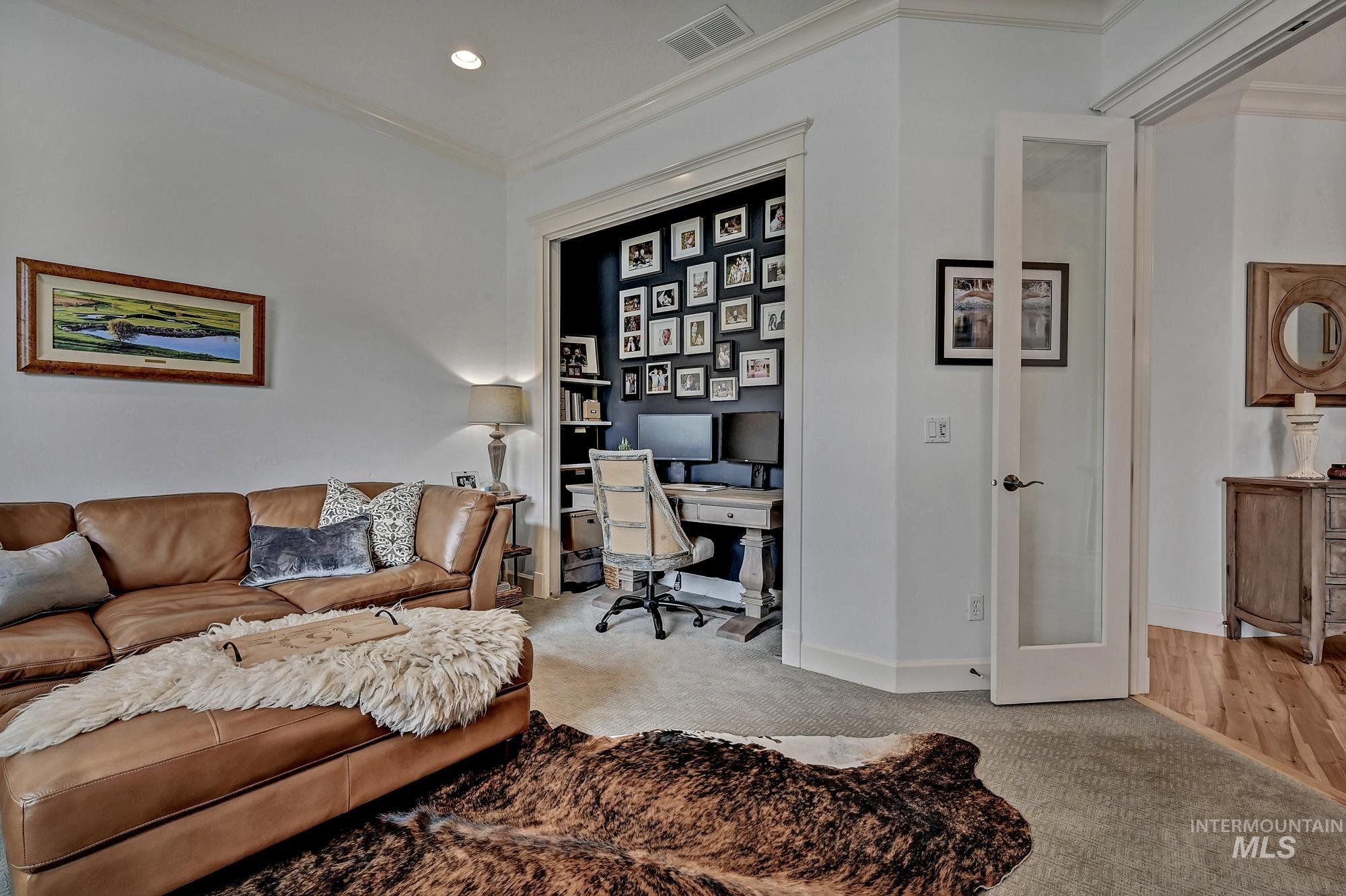 Home office with carpet floors, ornamental molding, french doors, and recessed lighting