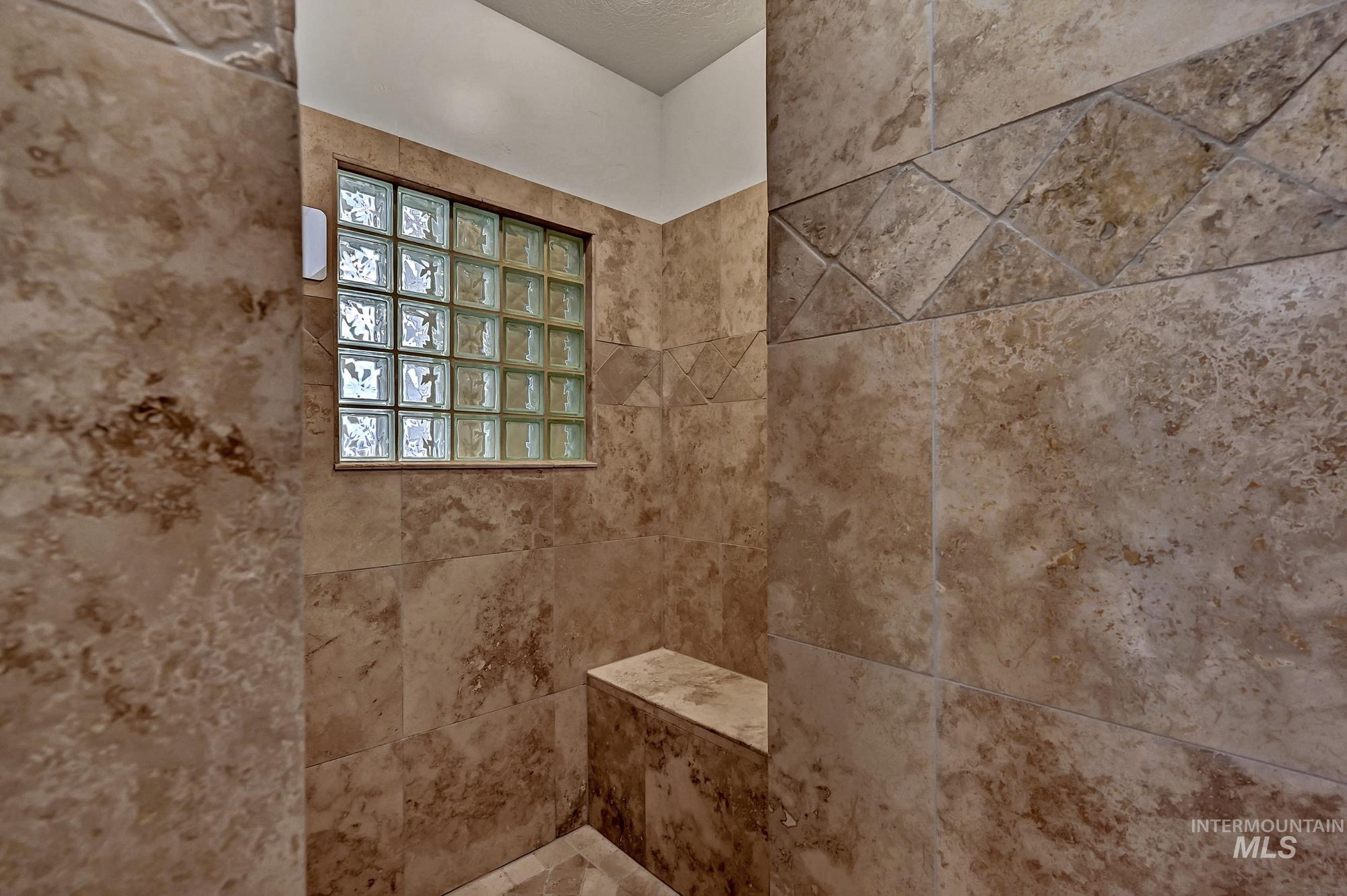 Bathroom view of tiled shower