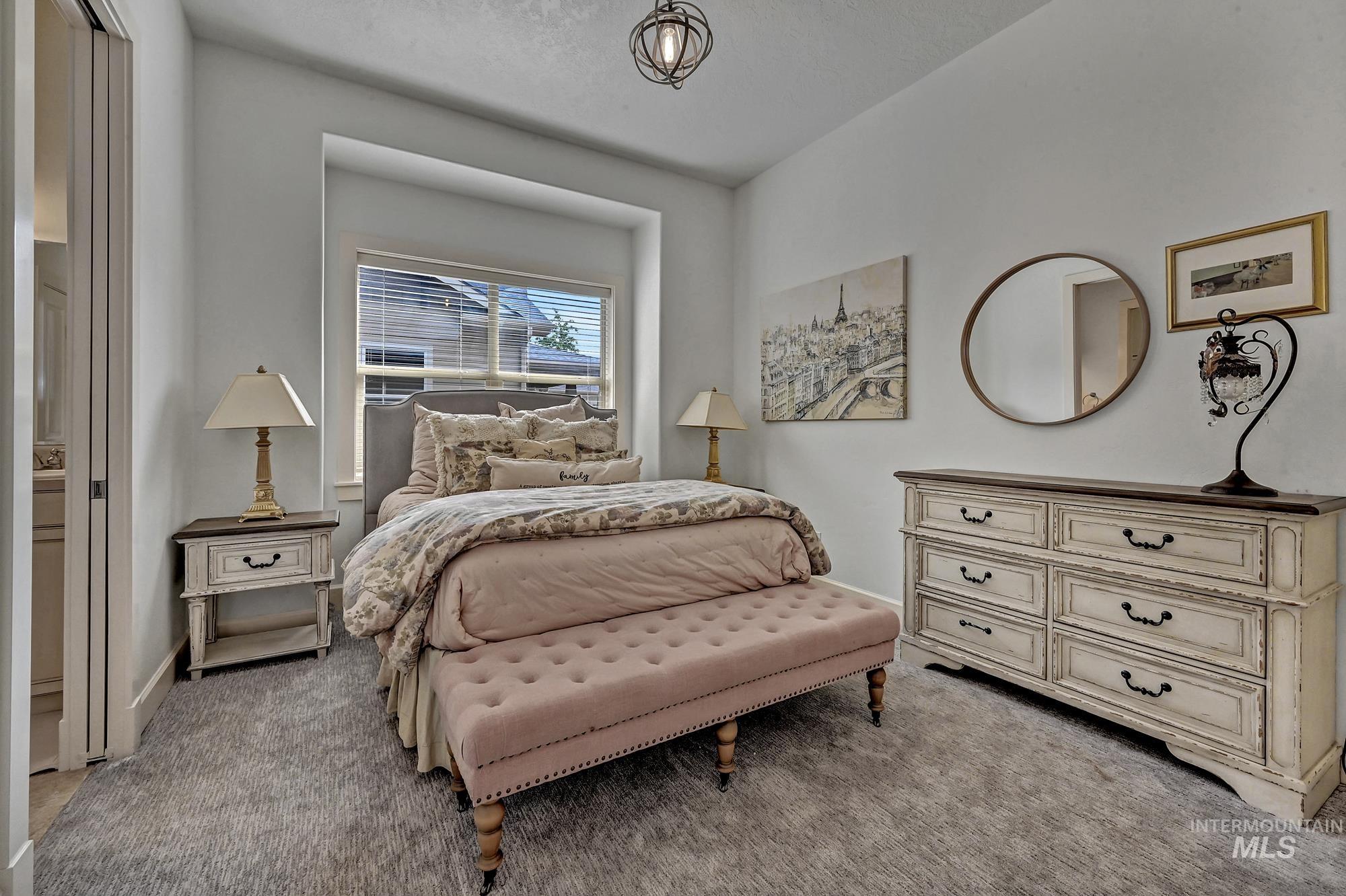 Bedroom featuring light colored carpet