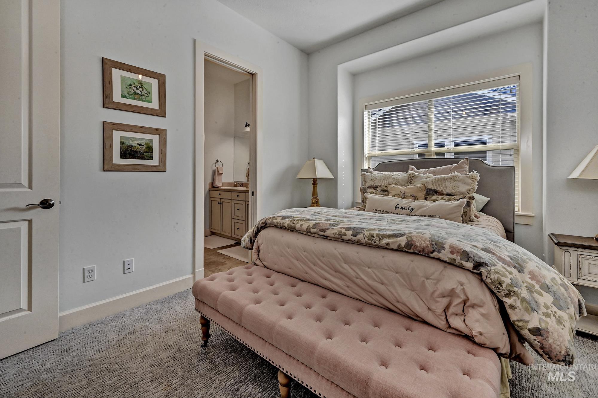 Bedroom with carpet and ensuite bathroom