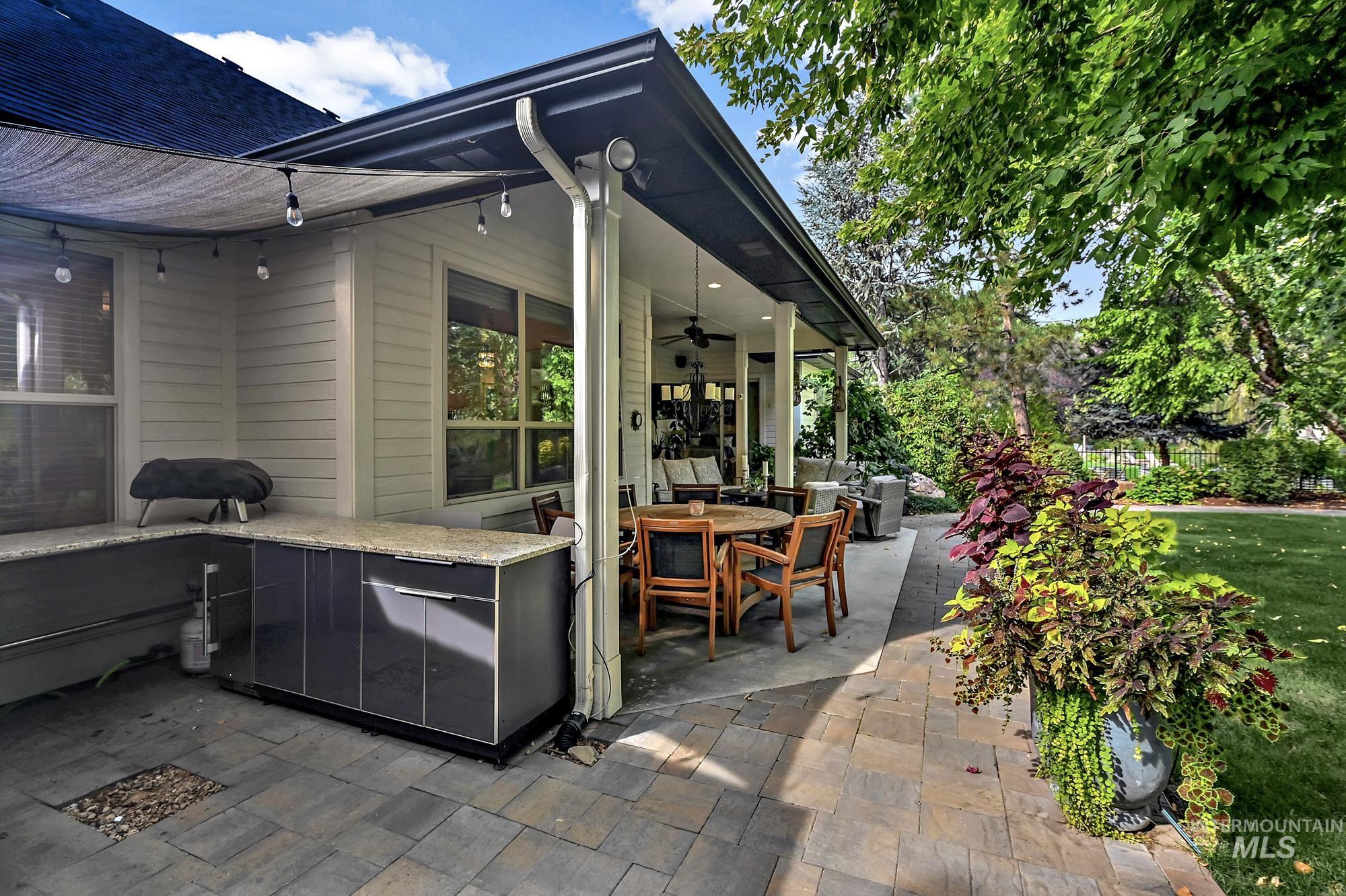 View of patio / terrace with outdoor dining area and a ceiling fan