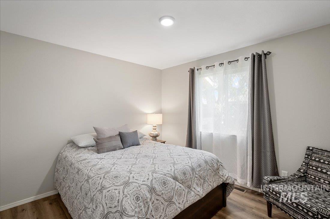 Bedroom with wood finished floors