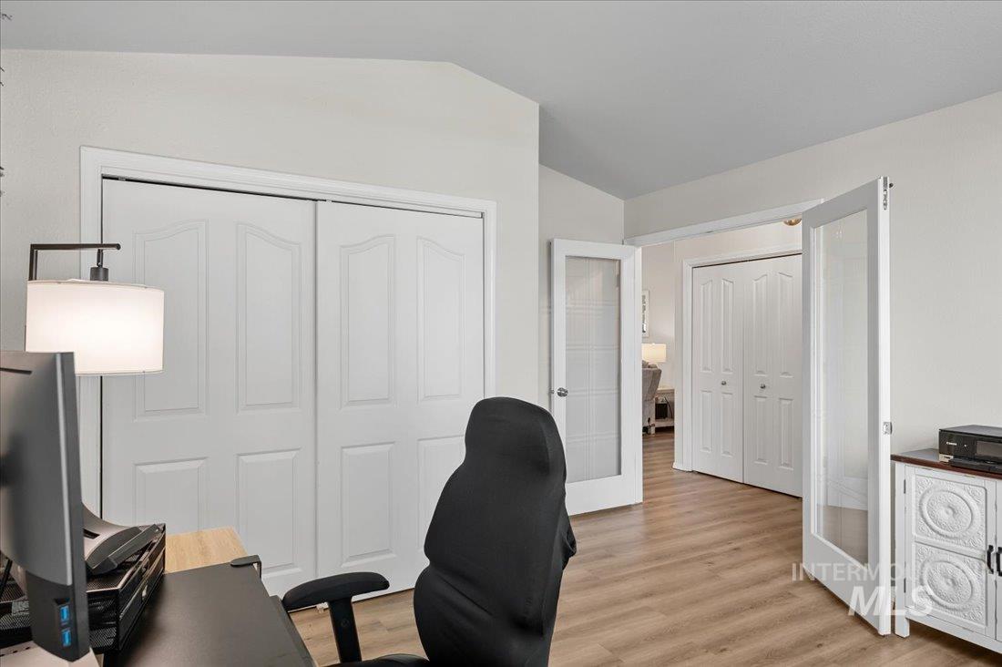 Office area featuring light wood-type flooring and french doors