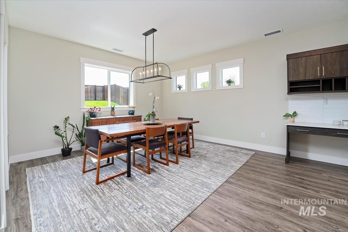 Dining space with wood finished floors