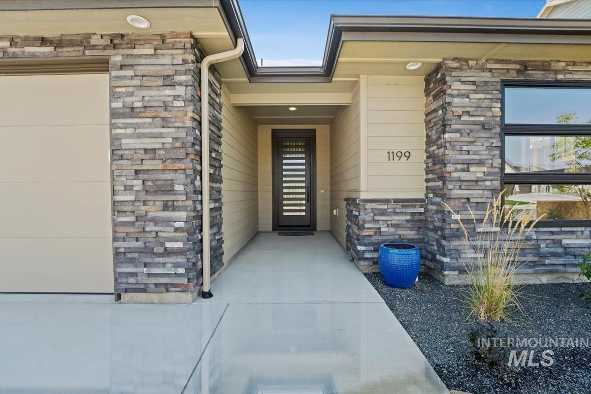 Property entrance with stone siding