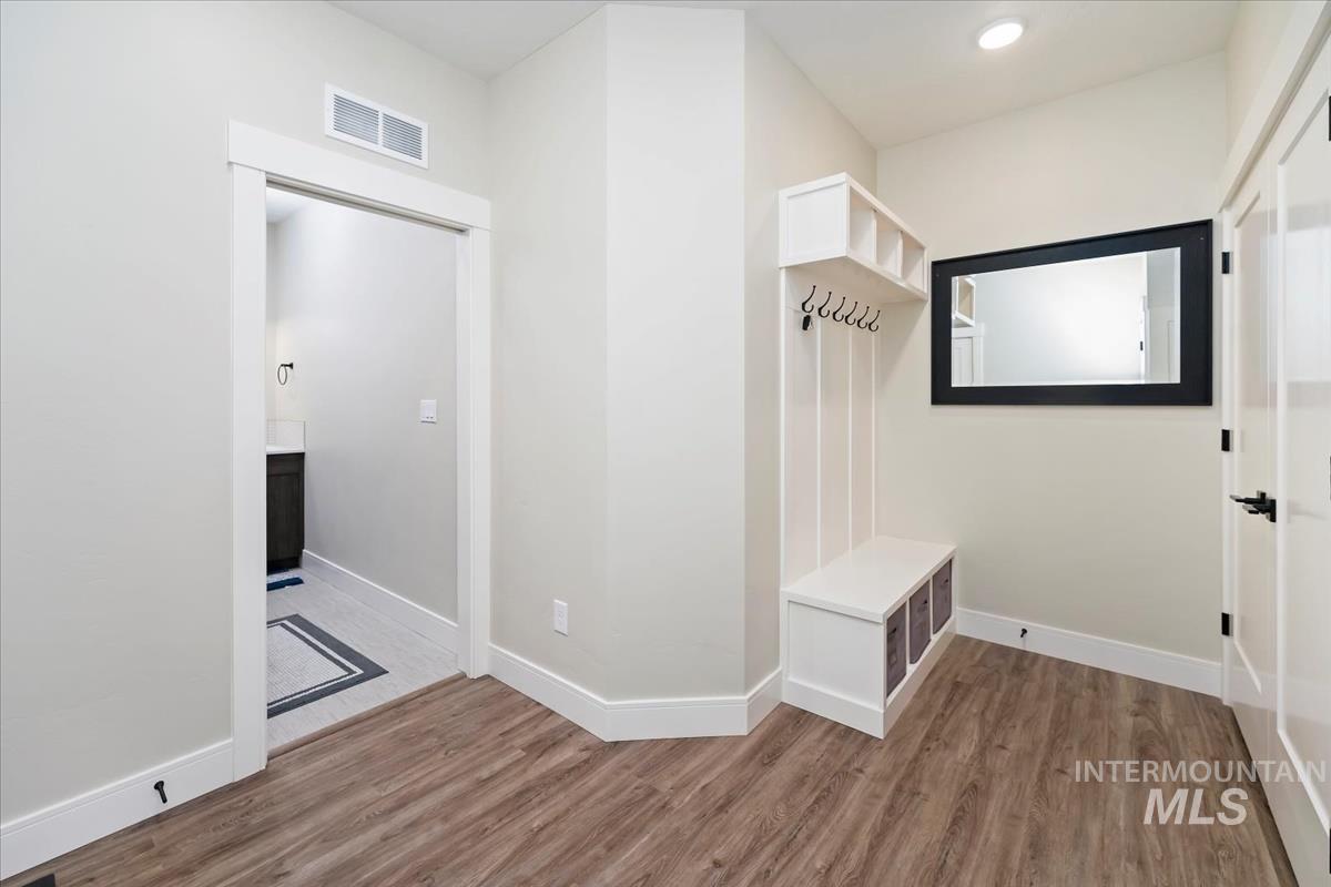Mudroom featuring light wood-type flooring